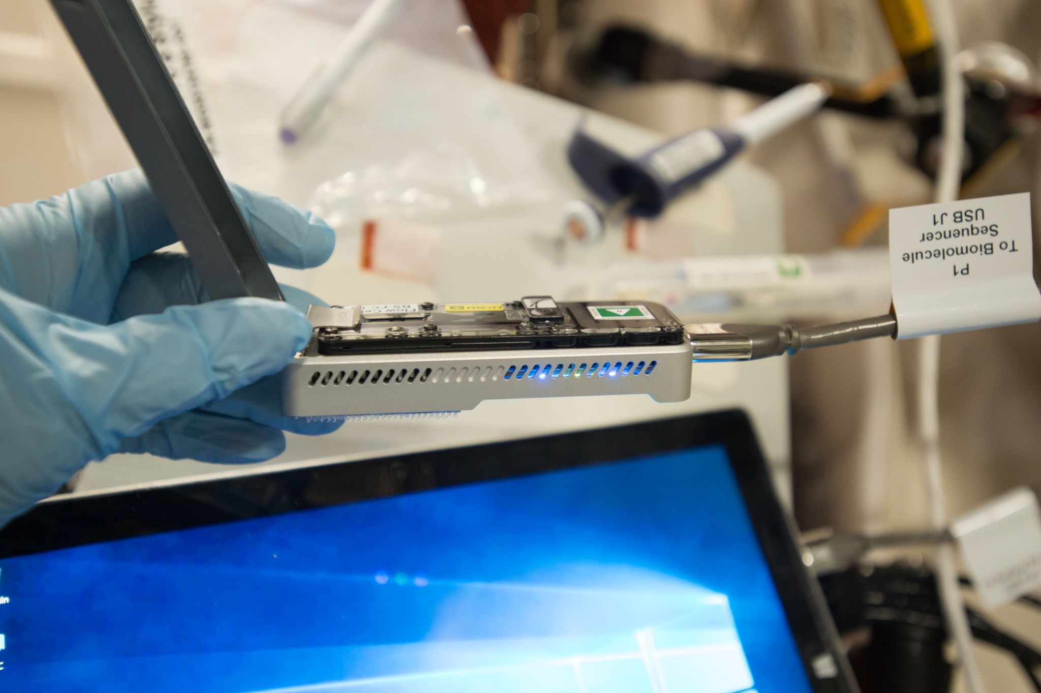 NASA astronaut Peggy Whitson sequences DNA using the Biomolecule Sequencer on the International Space Station. 