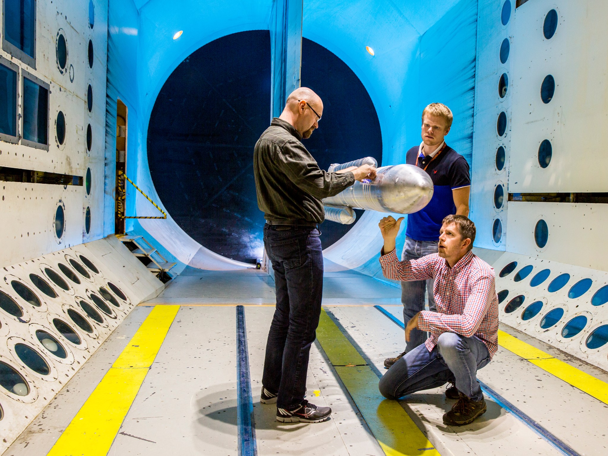 Final touches are made on a 10-foot model of the world’s most powerful rocket, the Space Launch System, just before testing it.