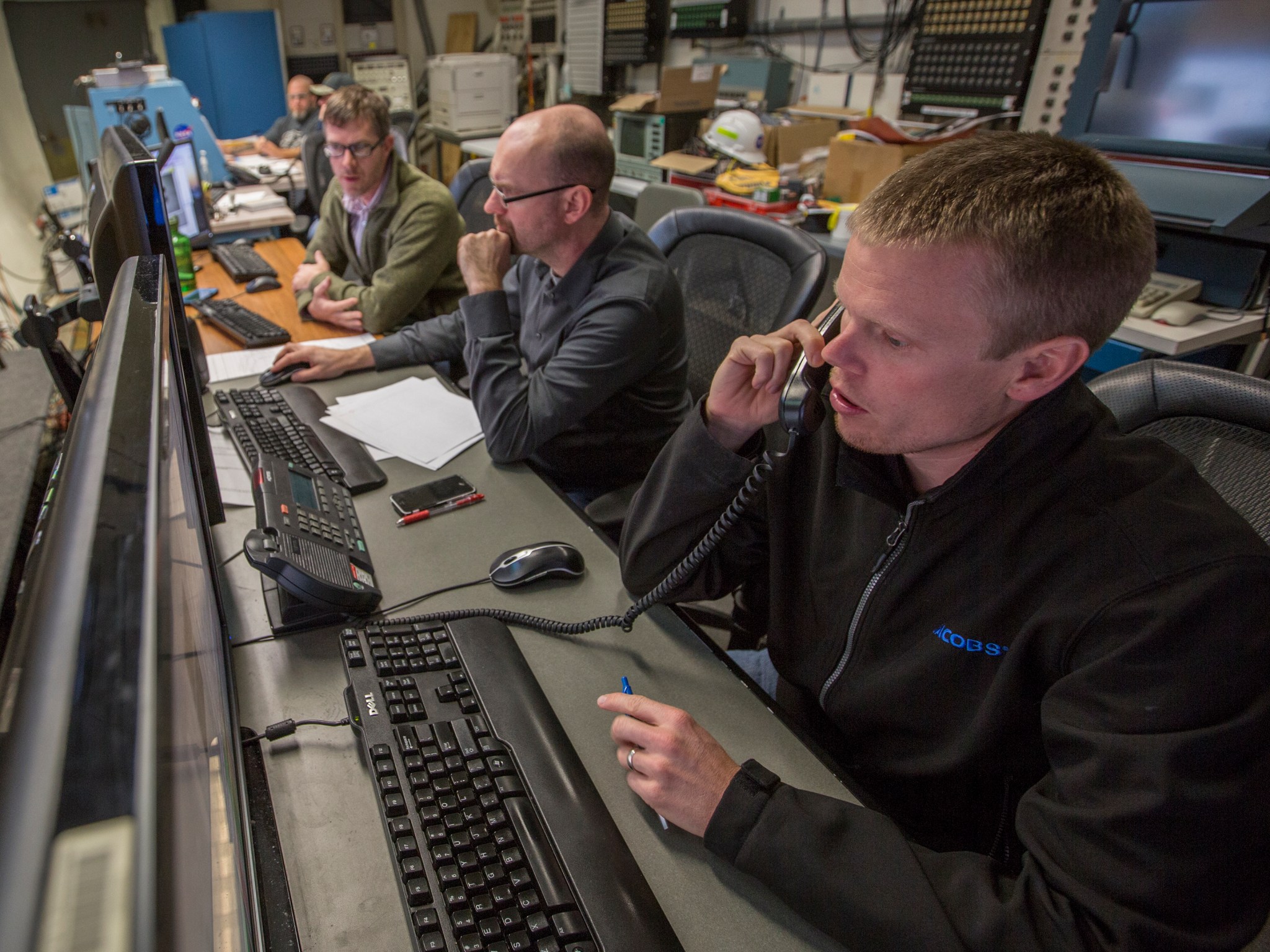 Rocket scientists at NASA’s Langley Research Center analyze data in the control room during wind tunnel testing.