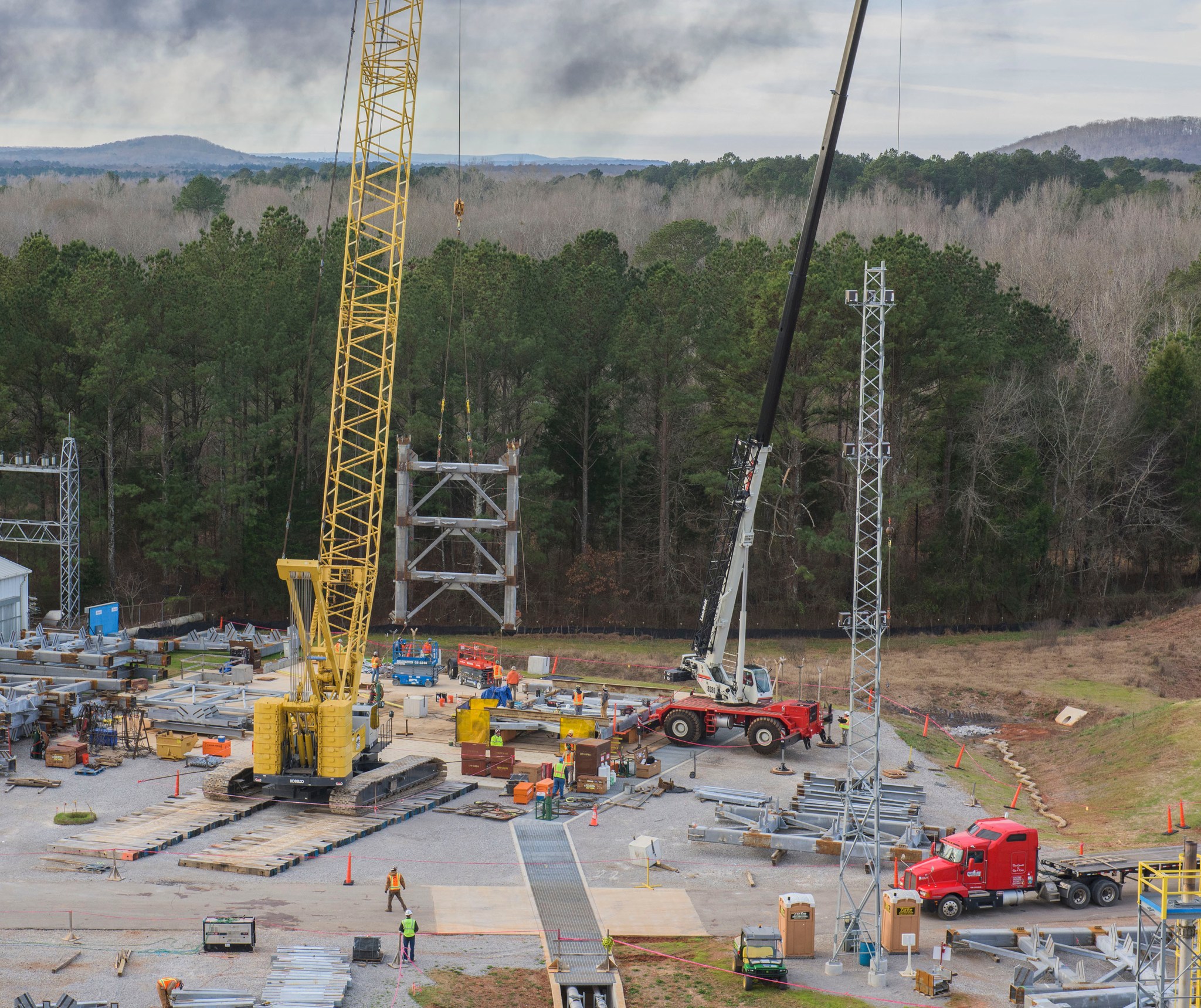A crane moves the first steel tier to be bolted into place on Jan. 6.