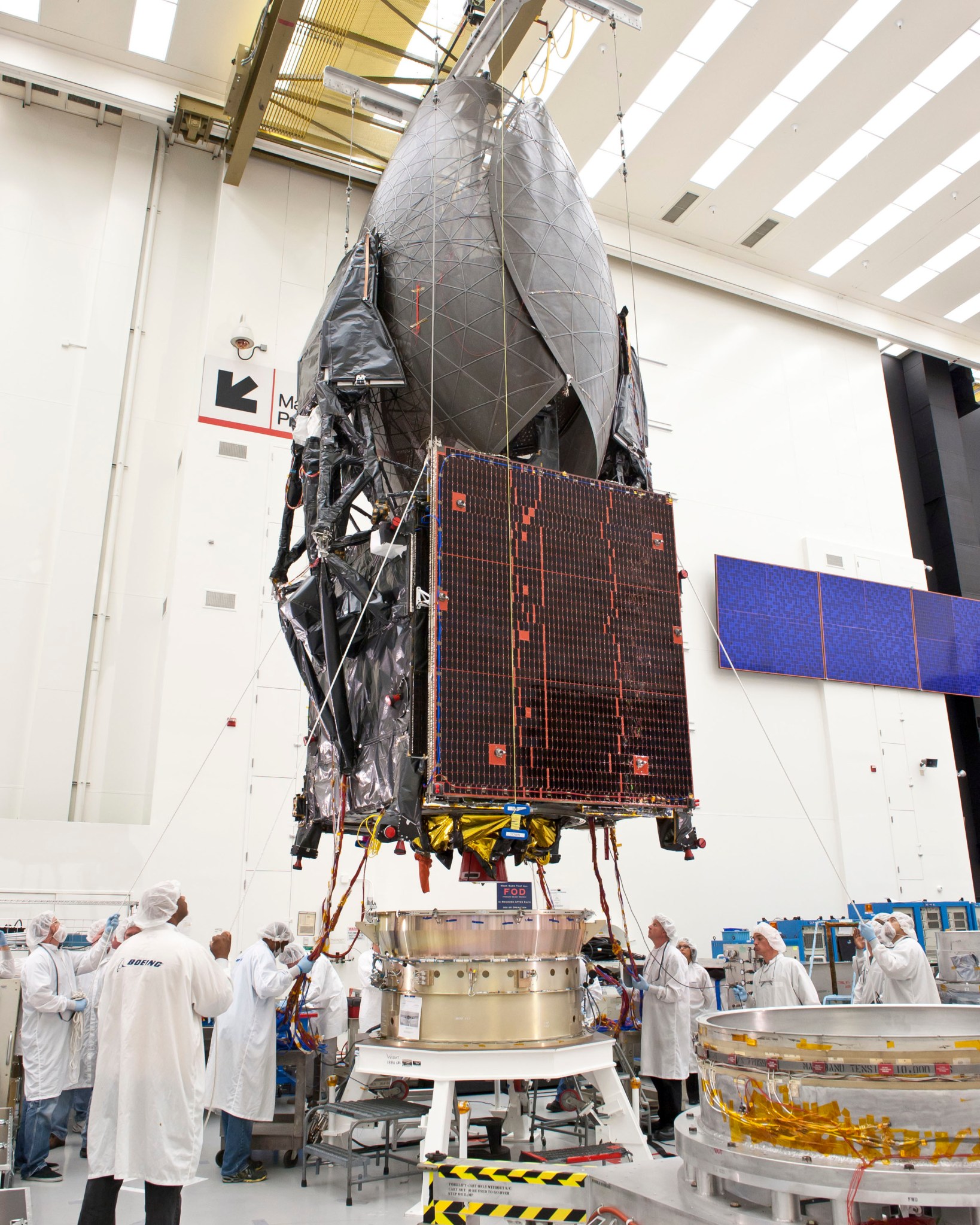 TDRS-K at Boeing, undergoing a fit check. 