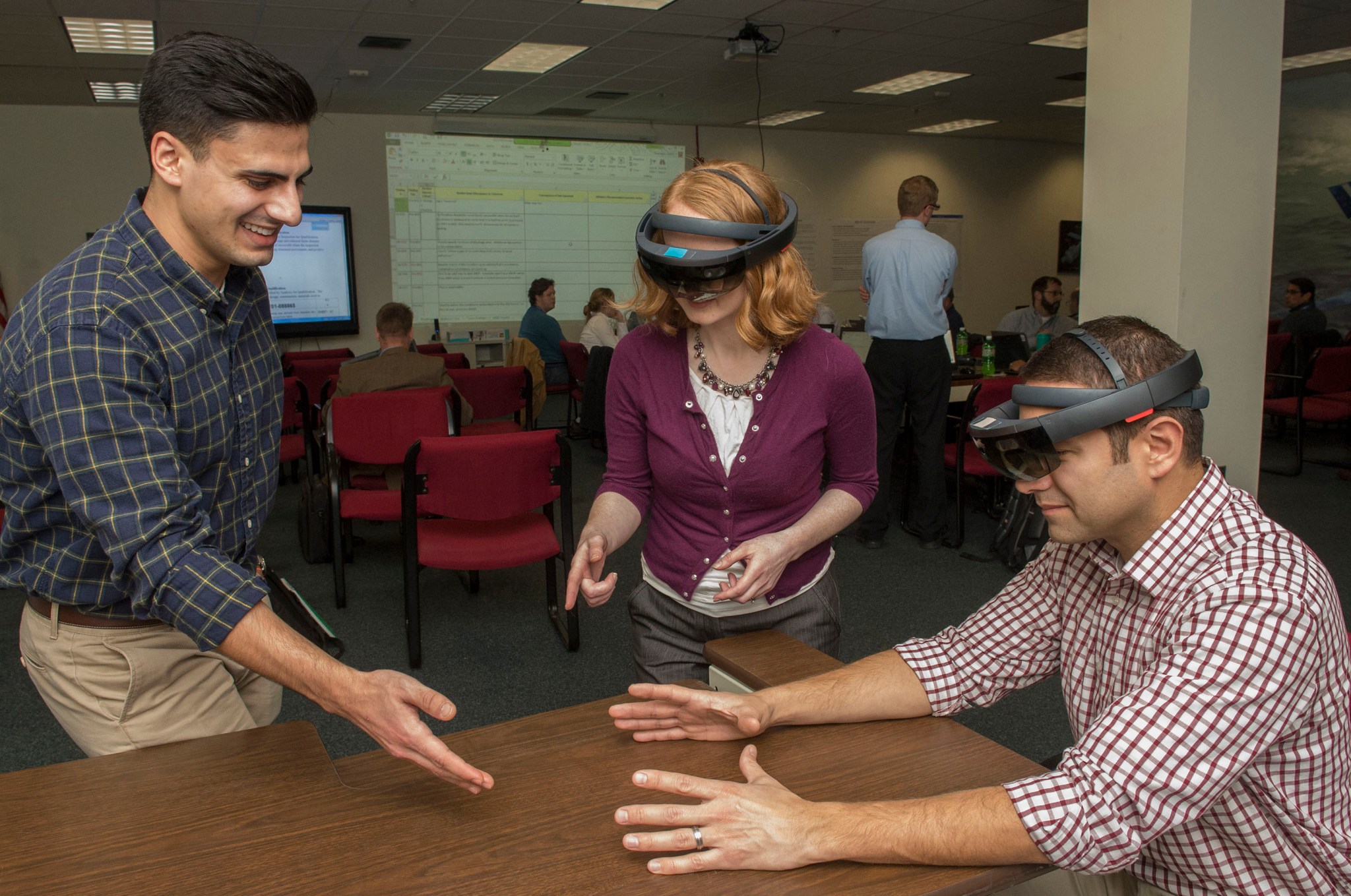 Reviewers use virtual reality glasses at the exploration upper stage preliminary design review. 