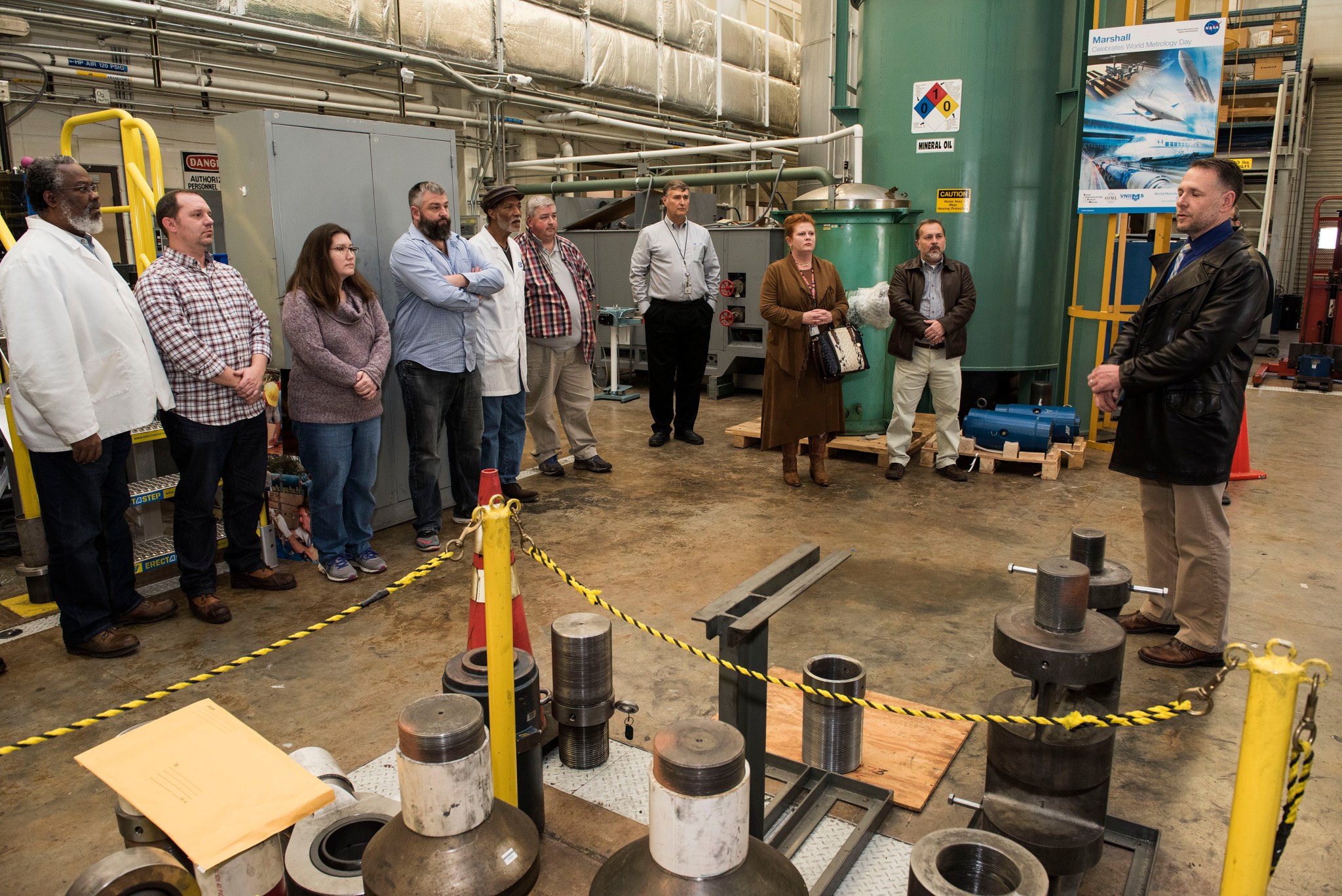 Tory Kessinger addresses Metrology and Calibration Laboratory laboratory personnel. 