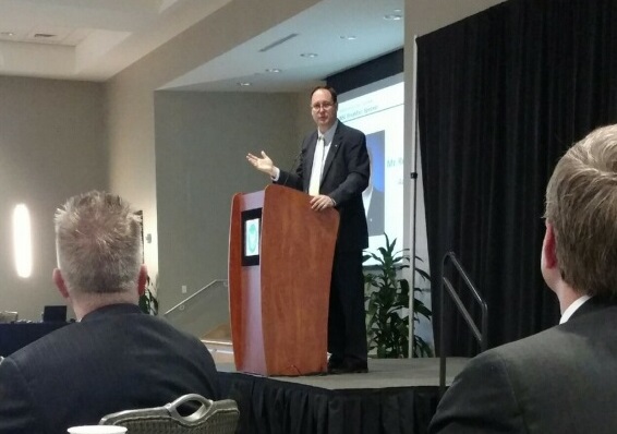 NASA Acting Administrator Robert Lightfoot addresses members of the National Space Club's Huntsville chapter during a breakfast.