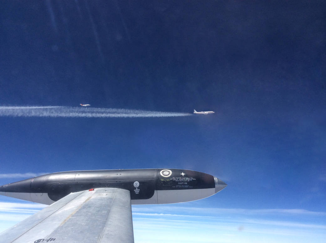 NASA's HU-25C Guardian aircraft flies 250 meters behind the agency's DC-8 aircraft