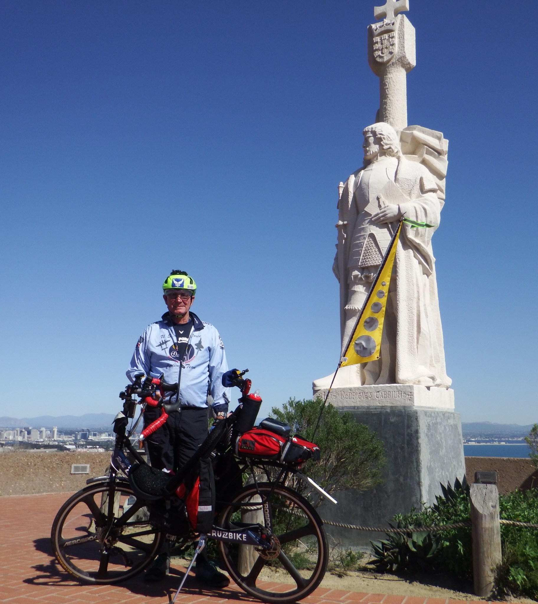 Robb Myer poses with the bike he'll ride across the country.