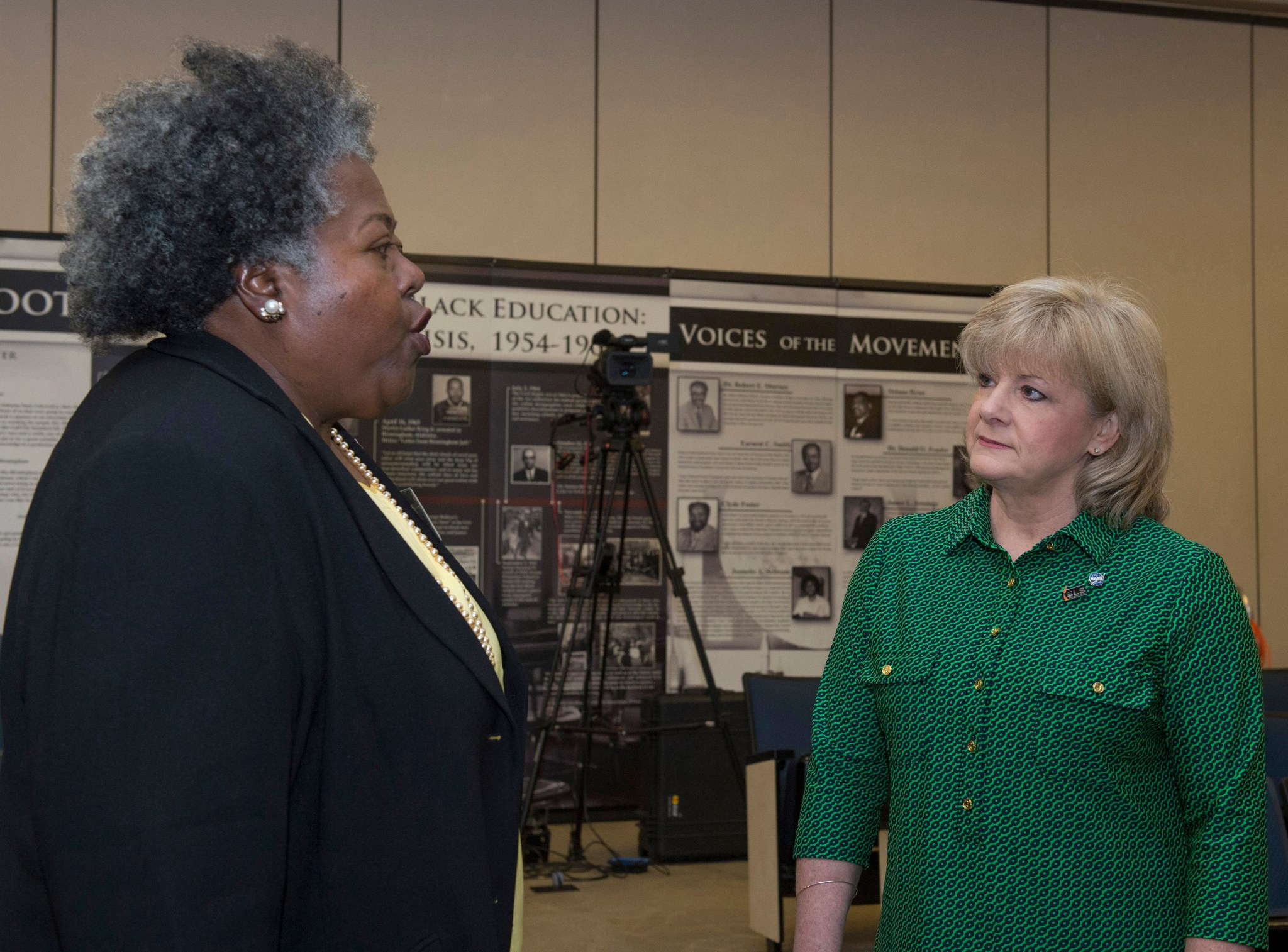 Deputy Director Jody Singer, left, and Regina Colston, a Freedom Forum fellow, discuss NASA's role in the civil rights movement.