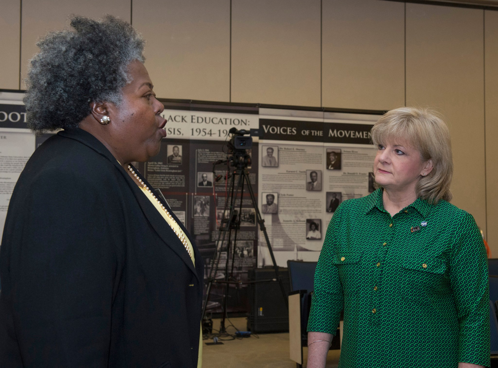 Deputy Director Jody Singer, left, and Regina Colston, a Freedom Forum fellow, discuss NASA's role in the civil rights movement.