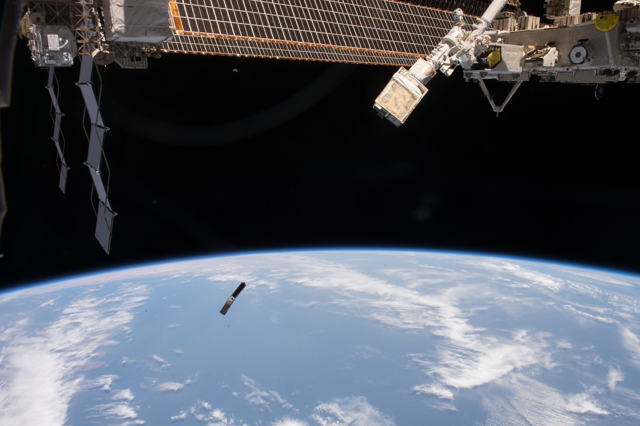 A series of small satellites are jettisoned from the International Space Station on March 6 using the NanoRack CubeSat Deployer.