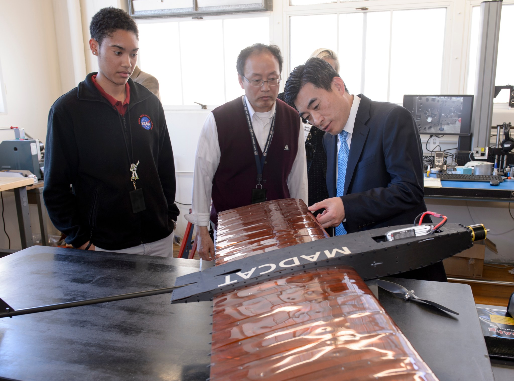 Dr. Shin looking at a wing that can change its shape.