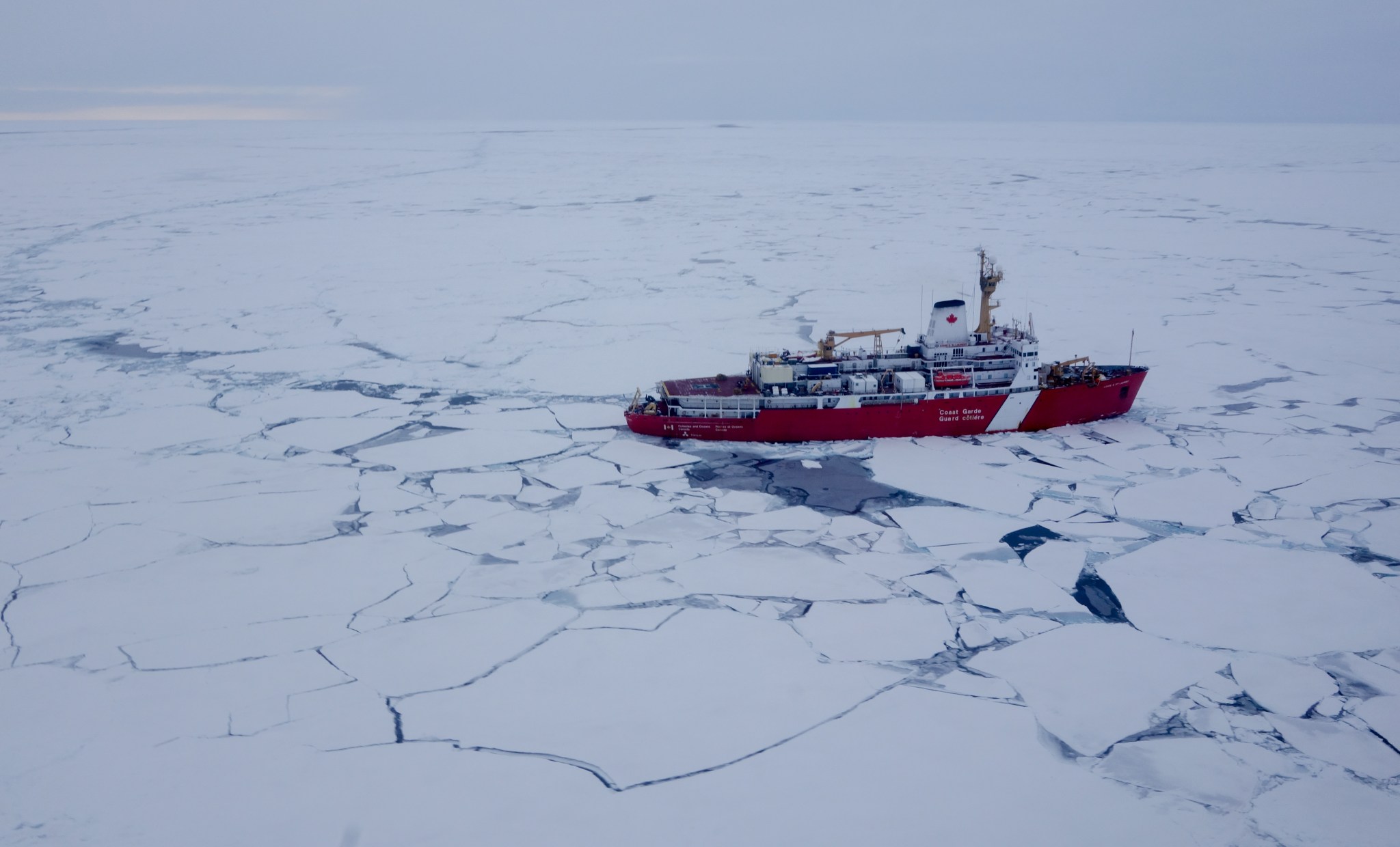 red ship moving through ice