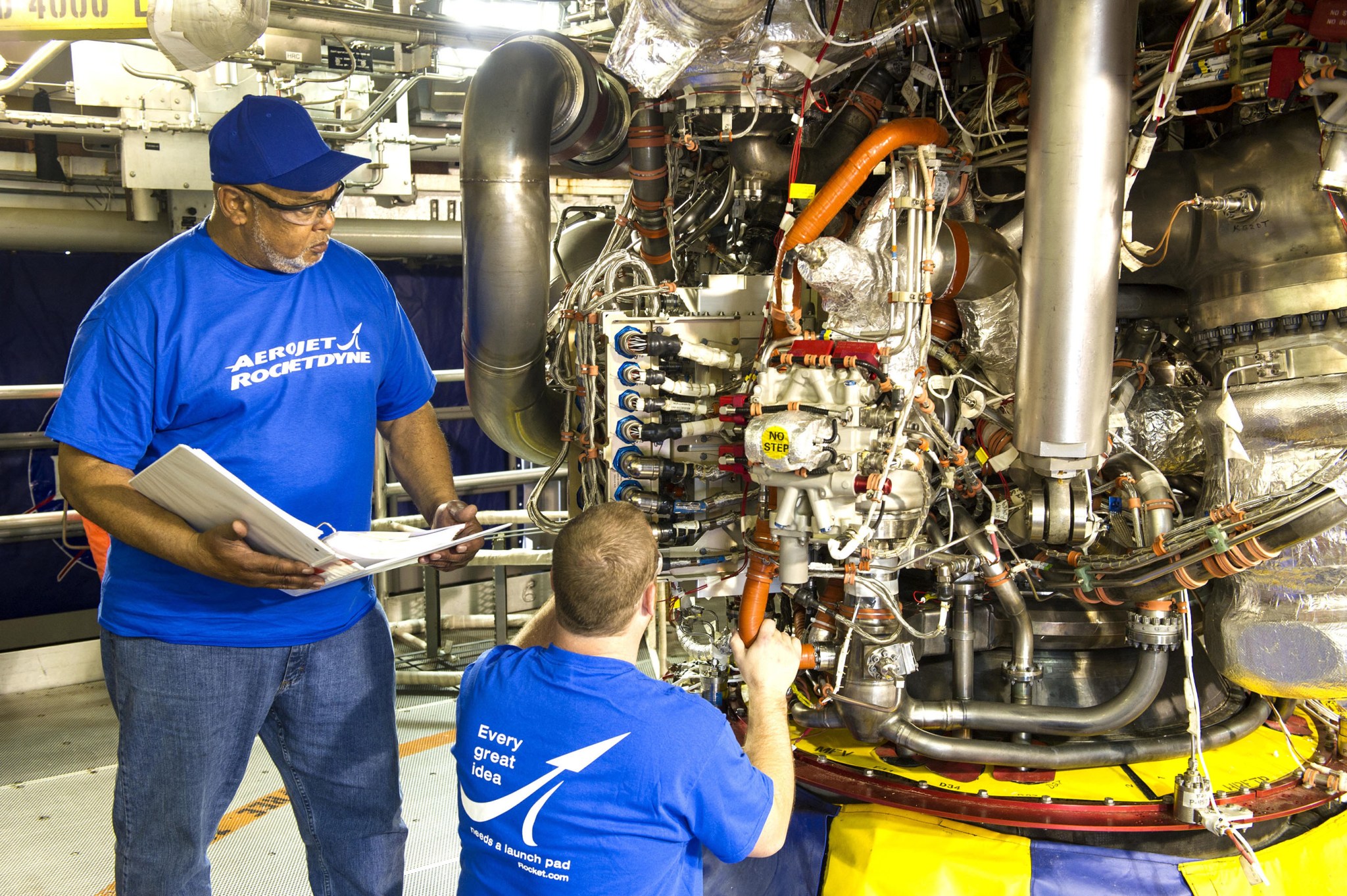 Aerojet Rocketdyne technicians inspect the engine controller