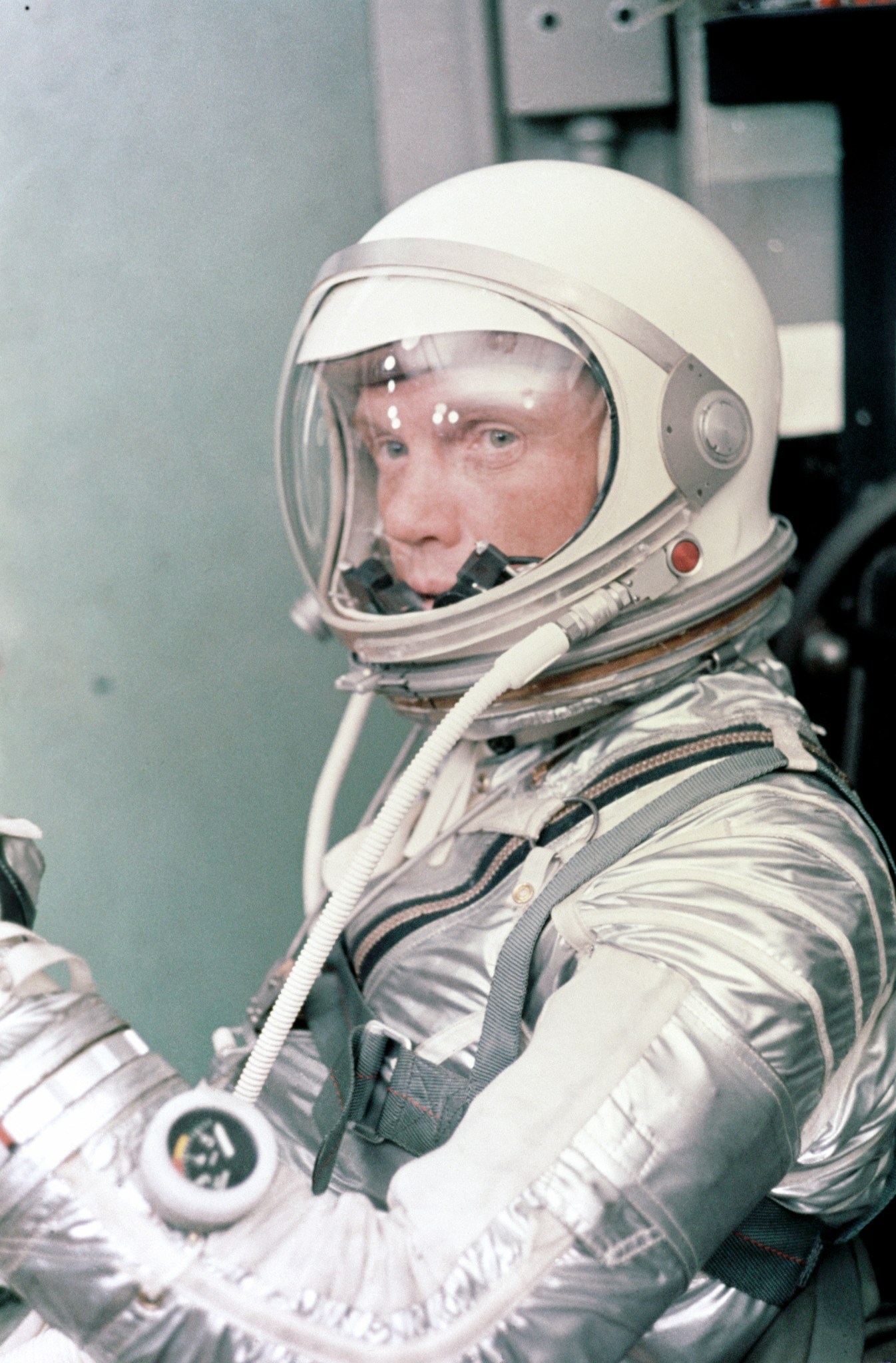 NASA astronaut John Glenn in silver spacesuit