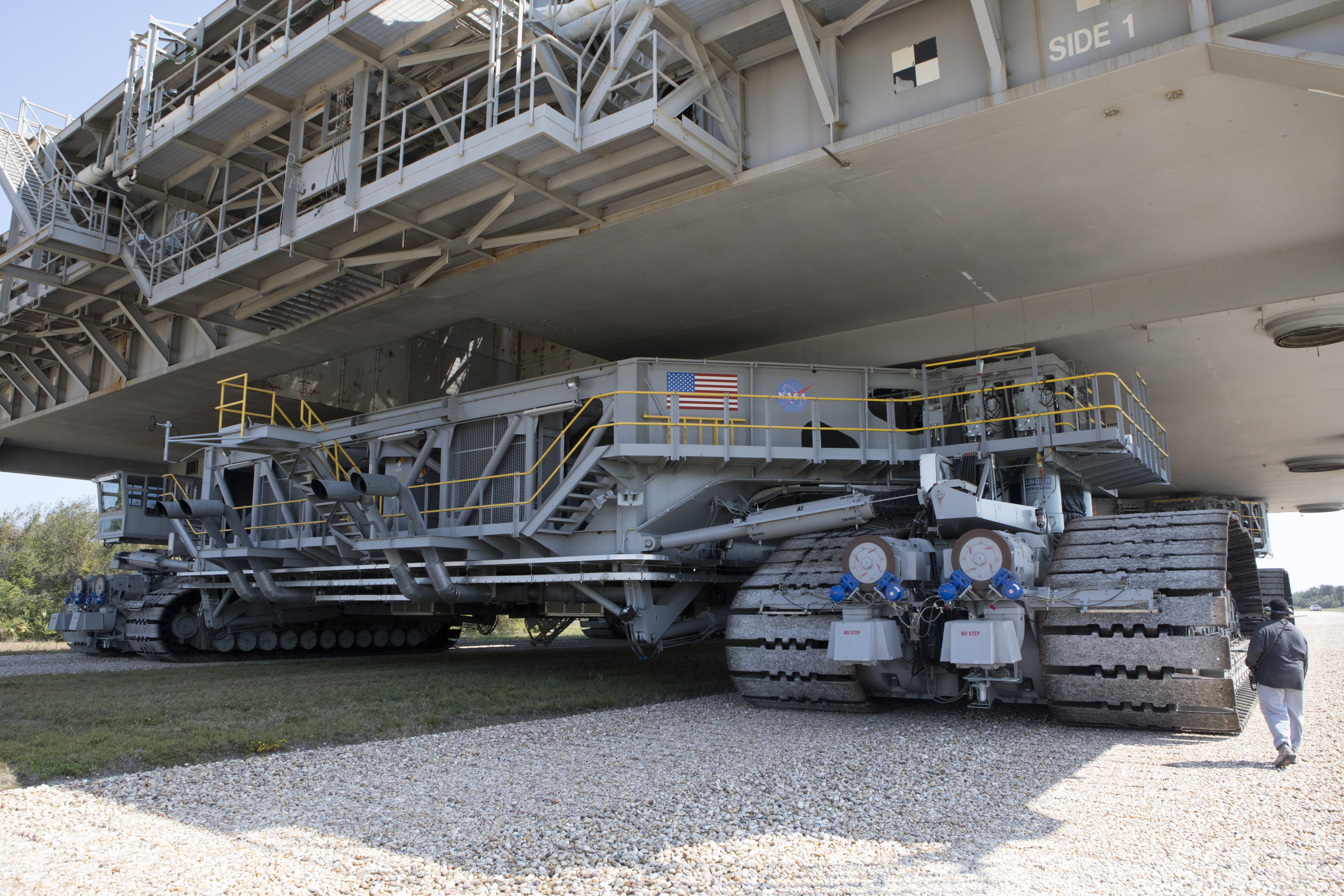 Crawler-transporter 2 with MLP-1 on top moves slowly along the crawlerway at Kennedy Space Center.