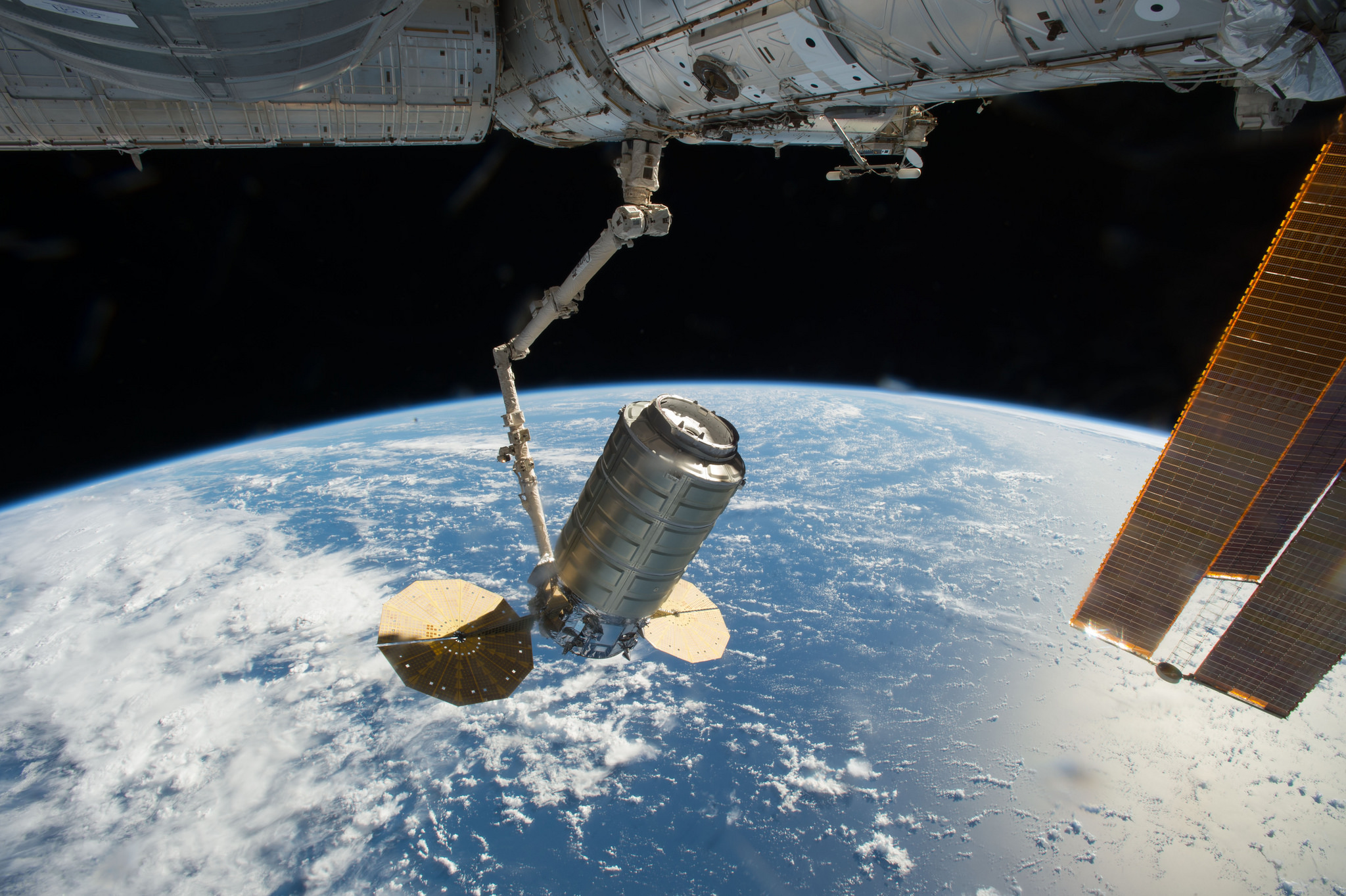 The International Space Station’s Canadarm2 robotic arm captures Orbital ATK's Cygnus cargo spacecraft.