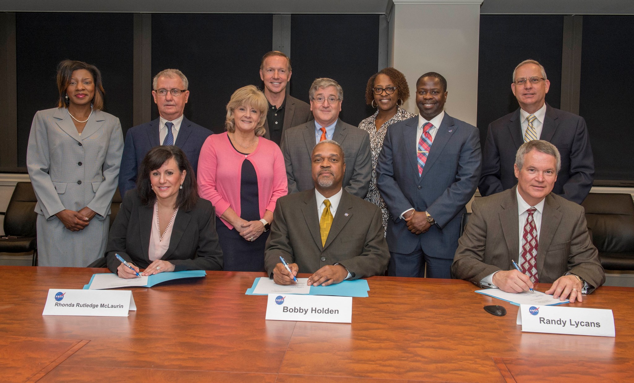 Representatives of NASA's Marshall Space Flight Center, Jacobs Technology Inc. and CRM Solutions sign a mentor-protégé agreement