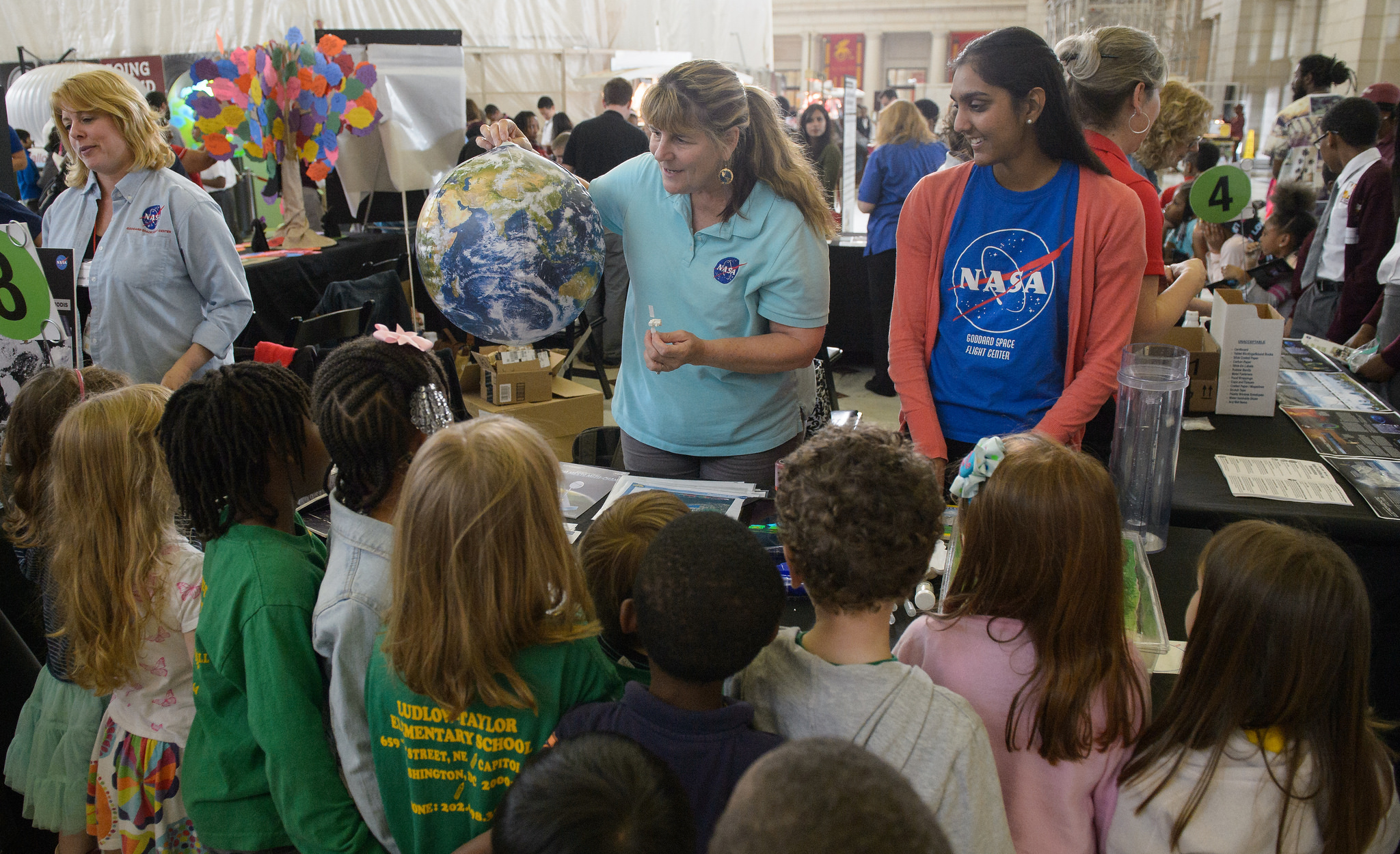 Visitors explore the exhibits at NASA's Earth Day event at Union Station in Washington, DC, Friday, April 22, 2016. 