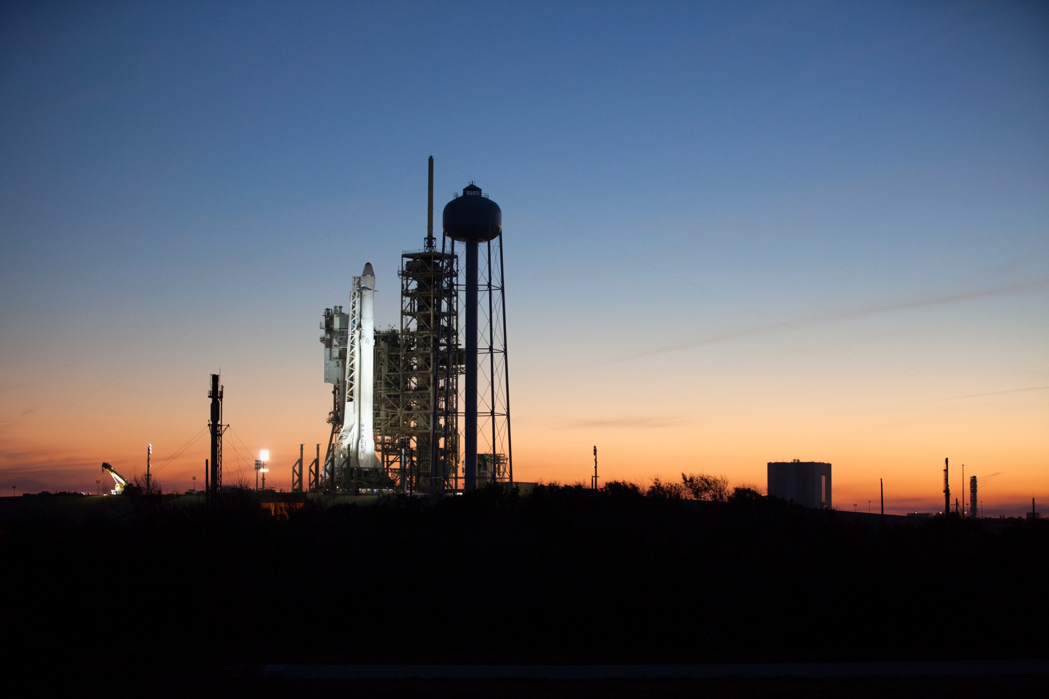 A Falcon 9 rocket stands ready for liftoff at the Kennedy Space Center's Launch Complex 39A for the SpaceX CRS-10 mission.