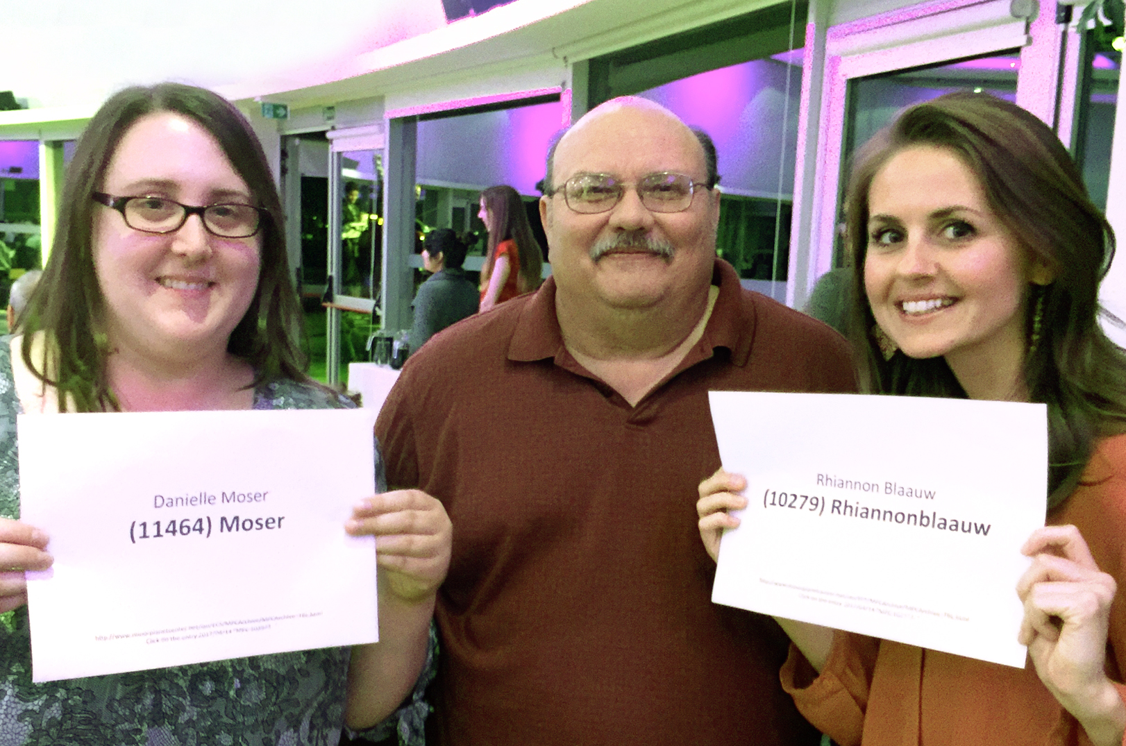 Bill Cooke is flanked by co-workers Danielle Moser, left, and Rhiannon Blaauw at the Asteroids, Meteors & Comets 2017 Conference