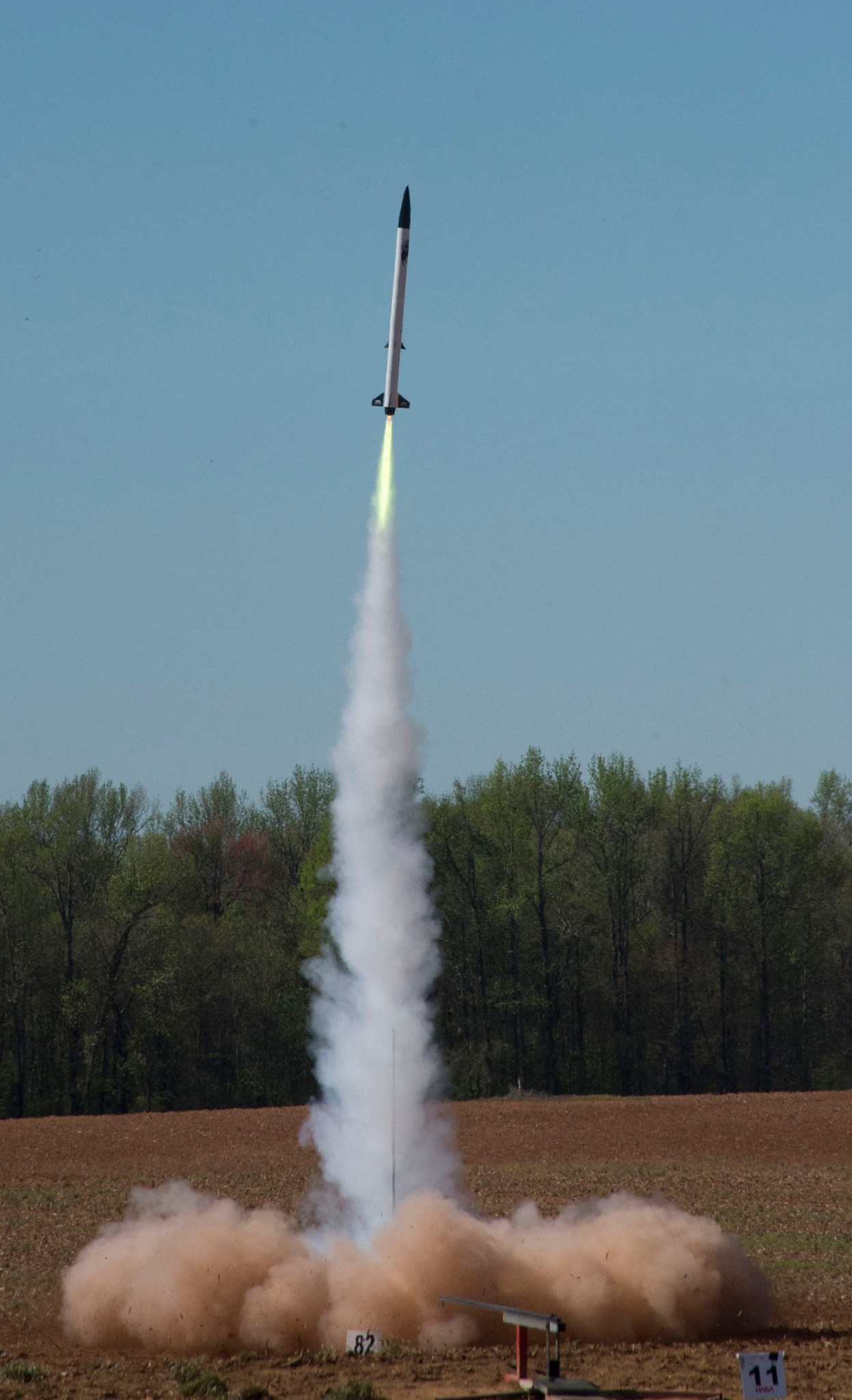 A high-powered rocket, one of nearly 50 student-built rockets, soars skyward during the 2017 Student Launch event. 