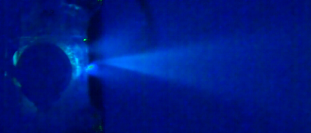 A plume from thruster testing of Team Miles’ CubeSat.
