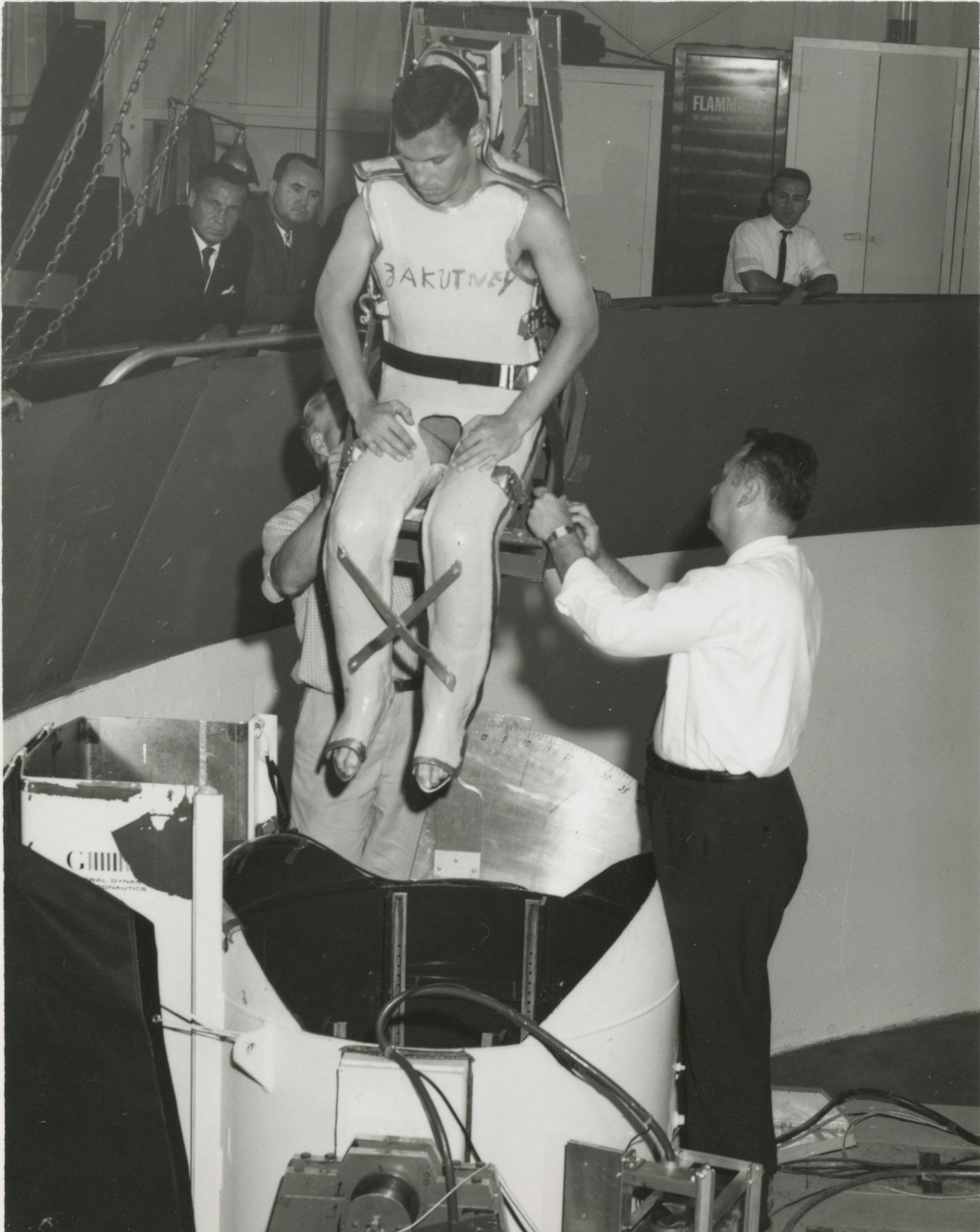 Study participant John Zakutney is lowered into a centrifuge pod.