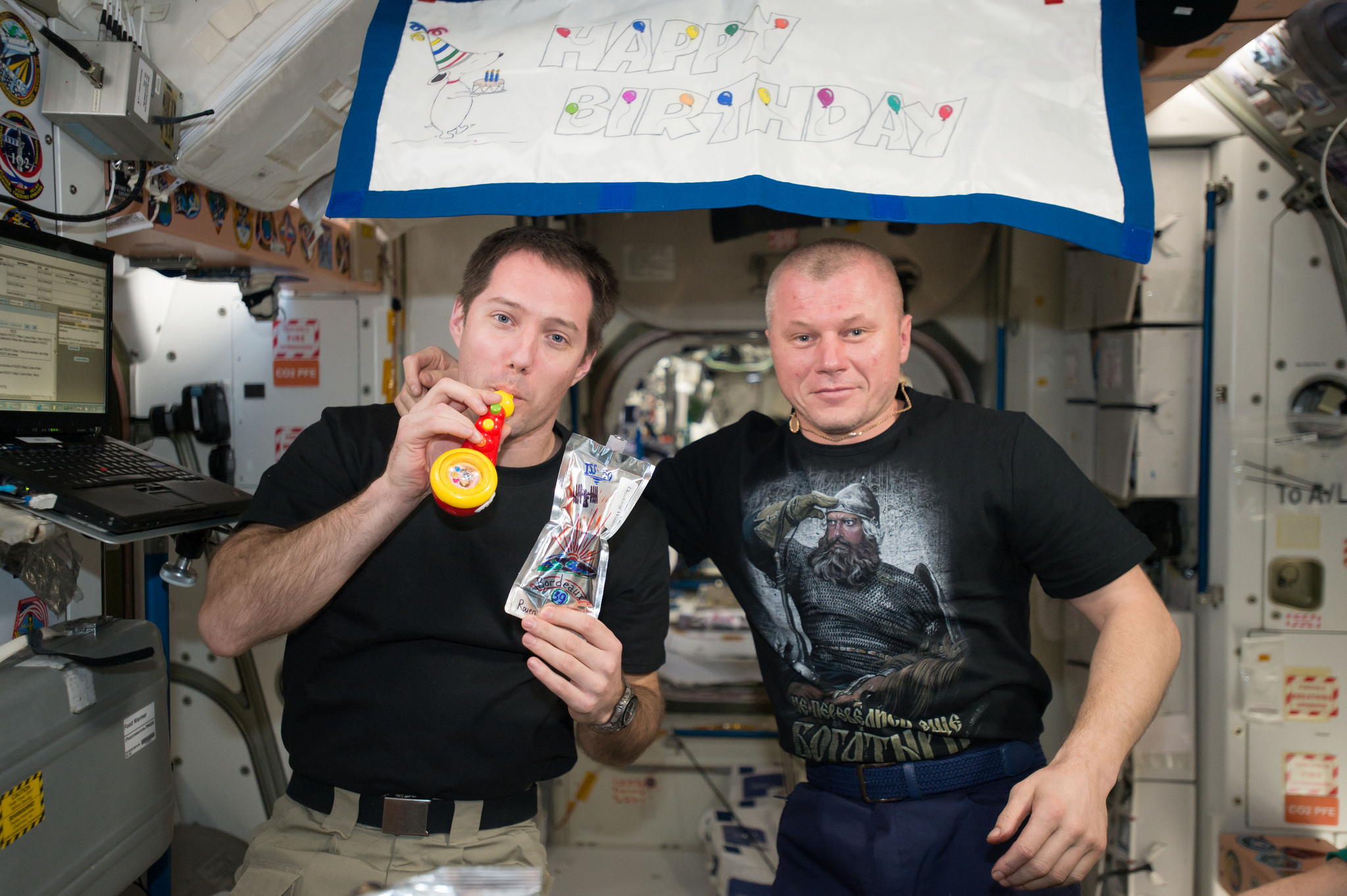 ESA (European Space Agency) astronaut Thomas Pesquet and Russian cosmonaut Oleg Novitskiy celebrate Pesquet's birthday