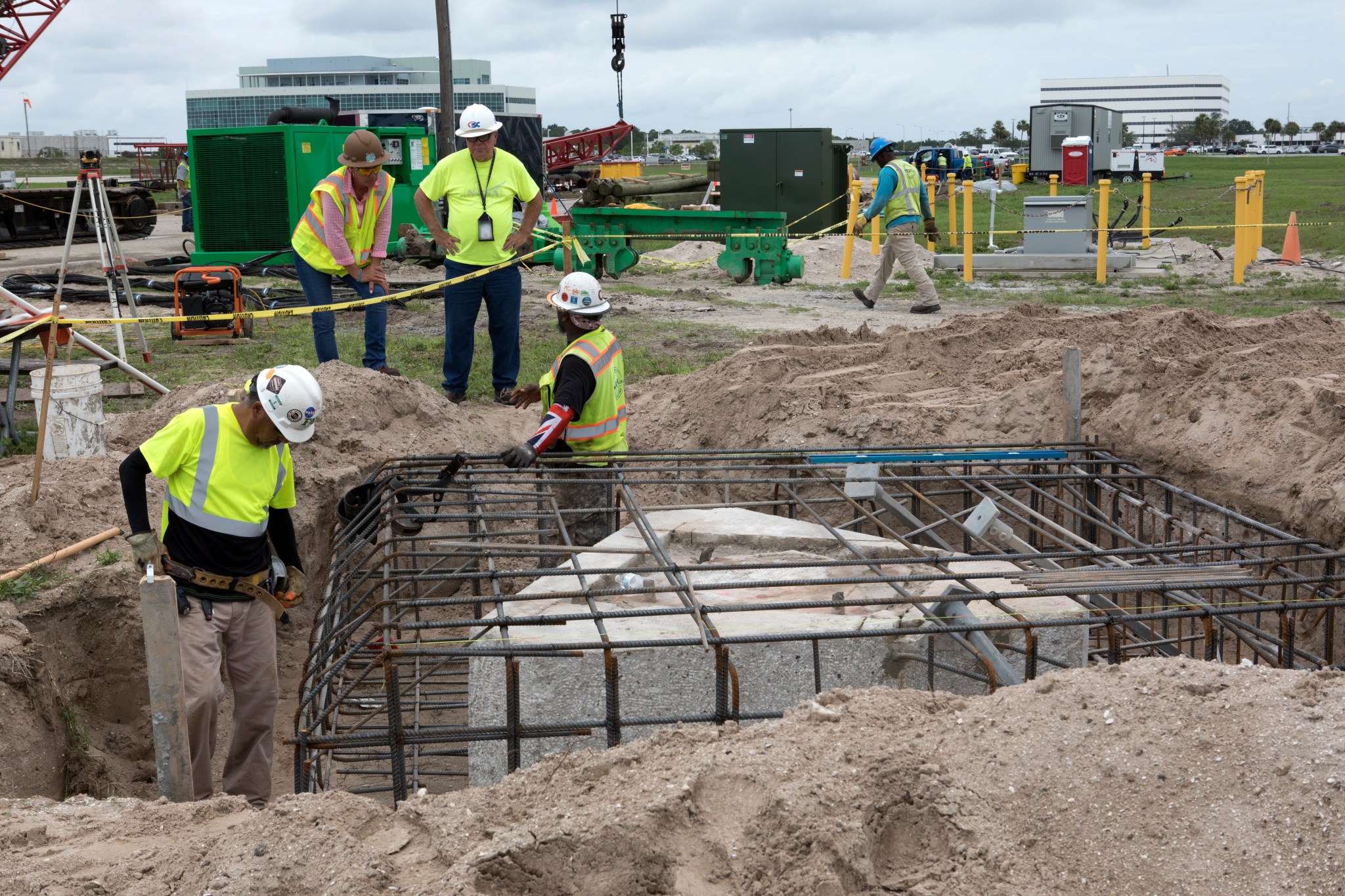 Construction workers work to shore up the turn basin area in the Launch Complex 39 area. 