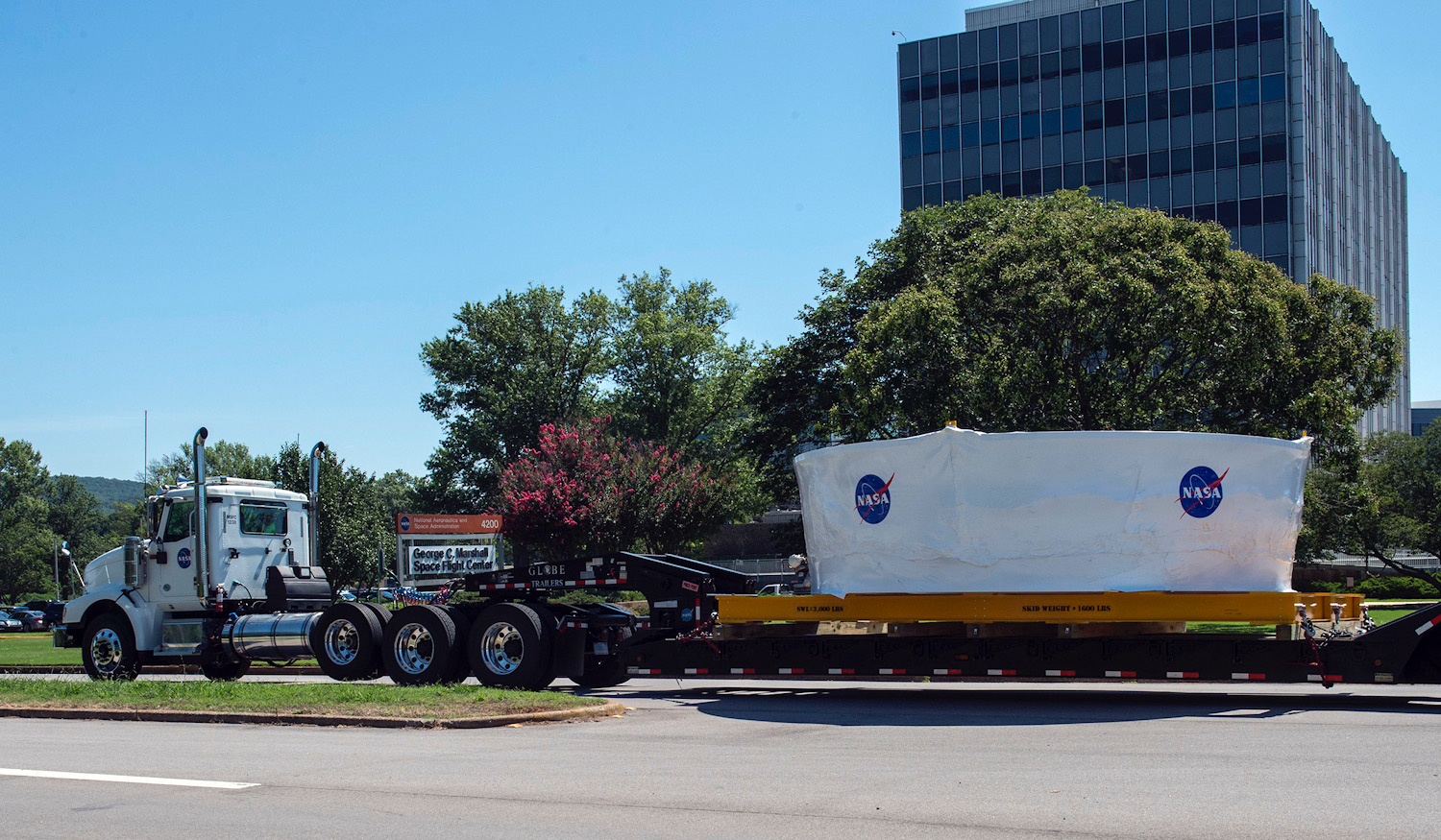 The Orion Stage Adapter structural test article for NASA’s Space Launch System makes its way July 10 to Redstone Army Airfield.