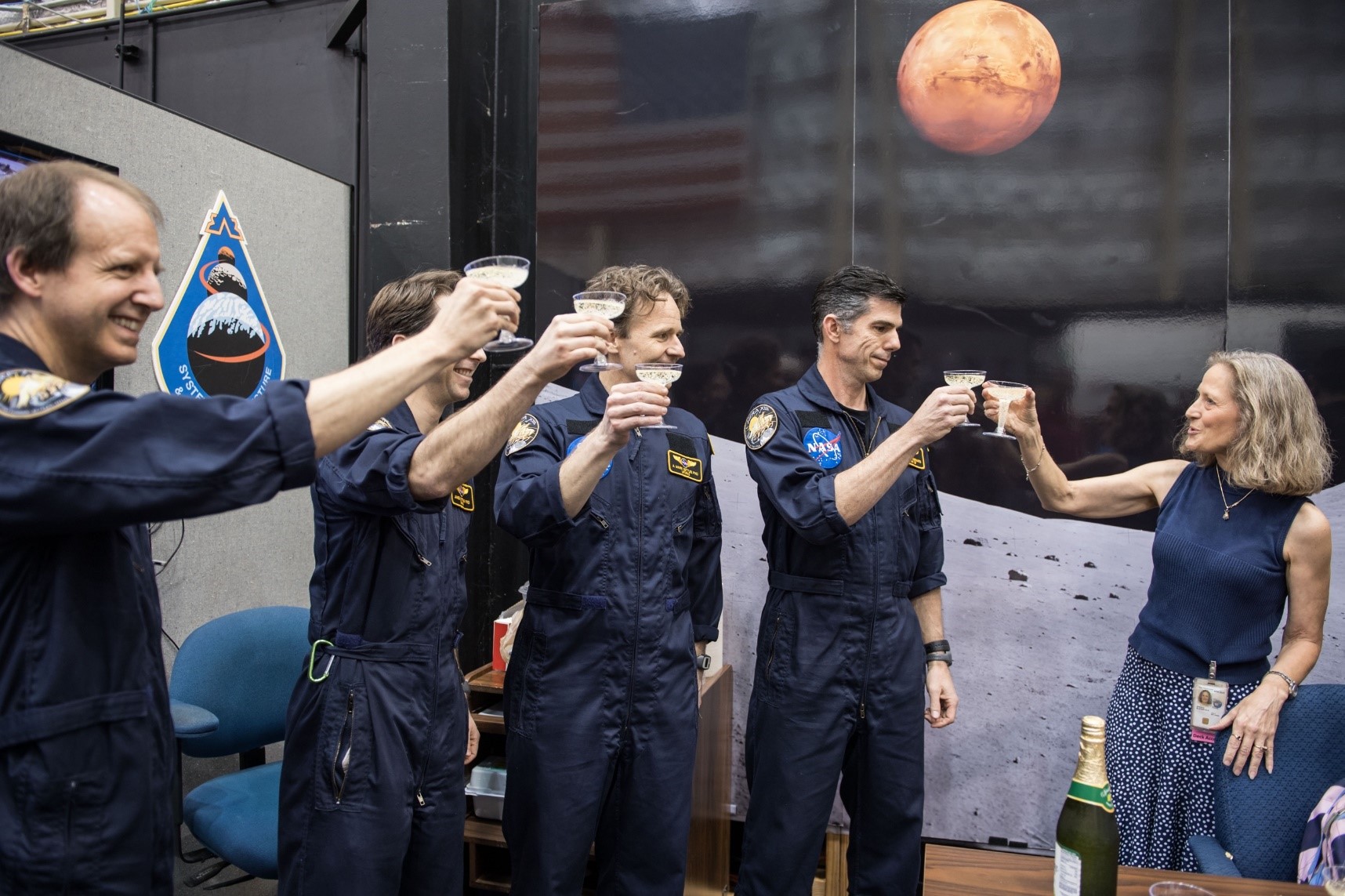 Flight Analog Program Manager, Lisa Spence, toasts with sparkling grape juice the HERA XIII crew for a successful end to the fir