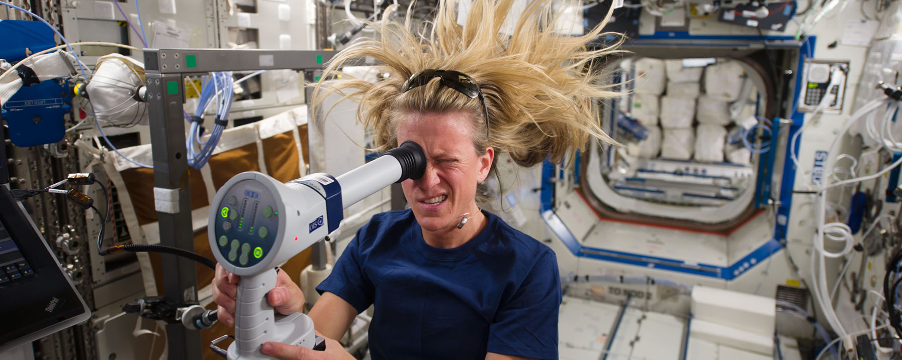 Astronaut Karen Nyberg Uses a Tool to Study Her Eyes on Space