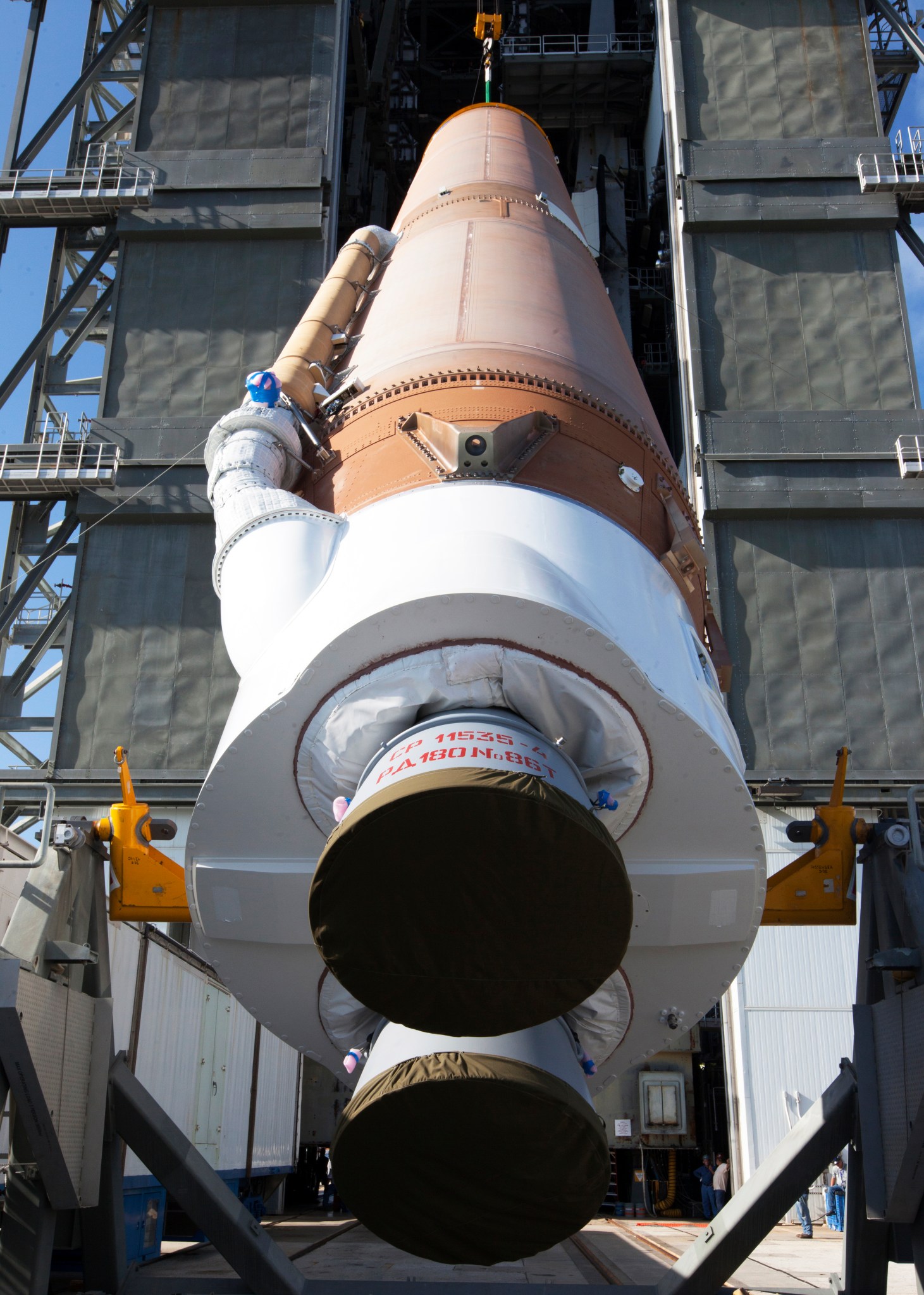 Atlas V first stage is lifted for TDRS-M