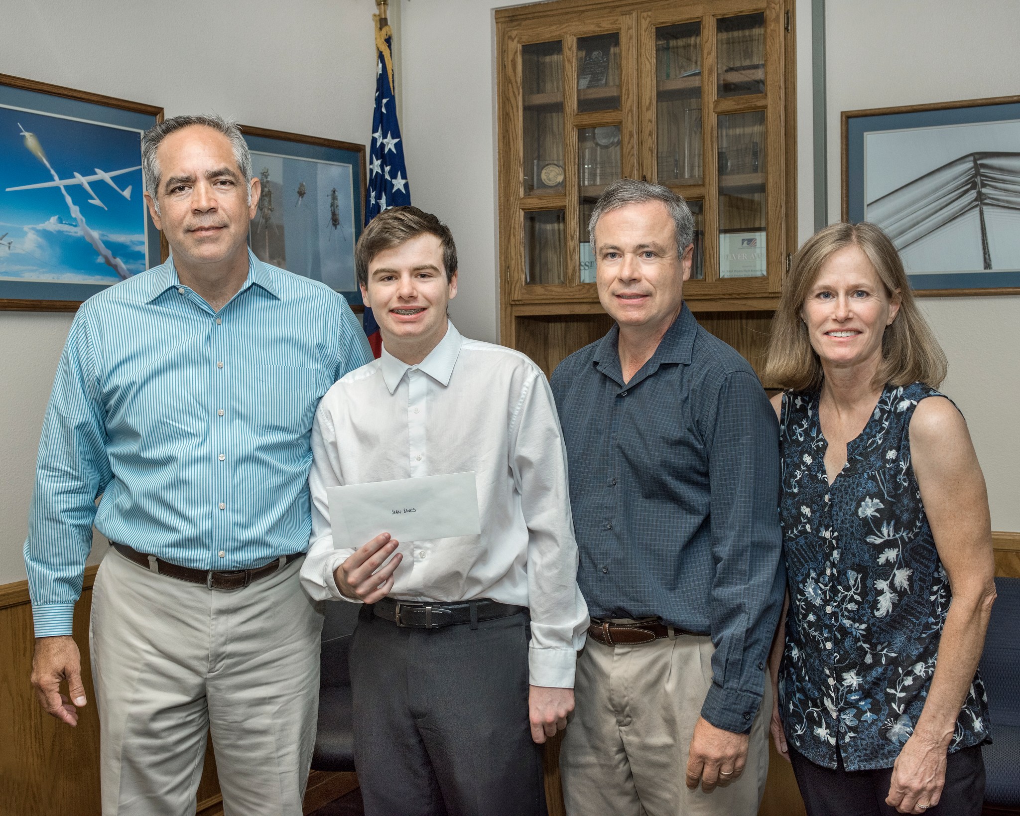 Sean Banks accepts the 2017 NASA Armstrong Exchange John W. Russell Memorial Scholarship from Center Director David McBride. 