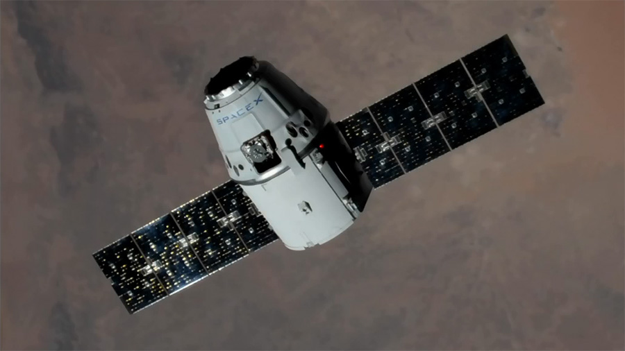 The SpaceX Dragon cargo craft approaches the International Space Station on Aug. 16.