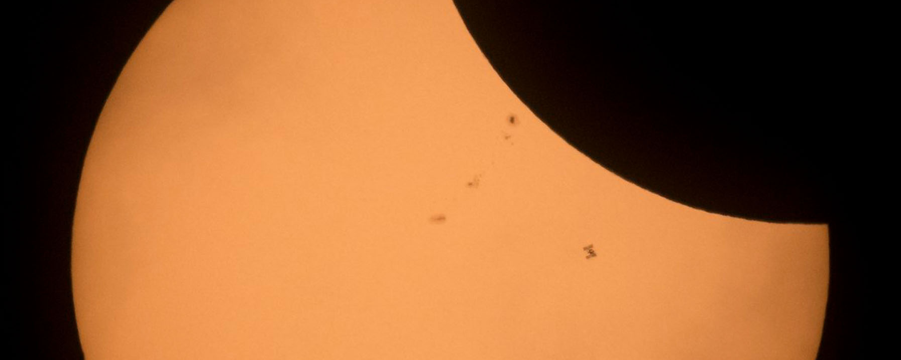 The International Space Station Transits the Sun During the 2017 Solar Eclipse