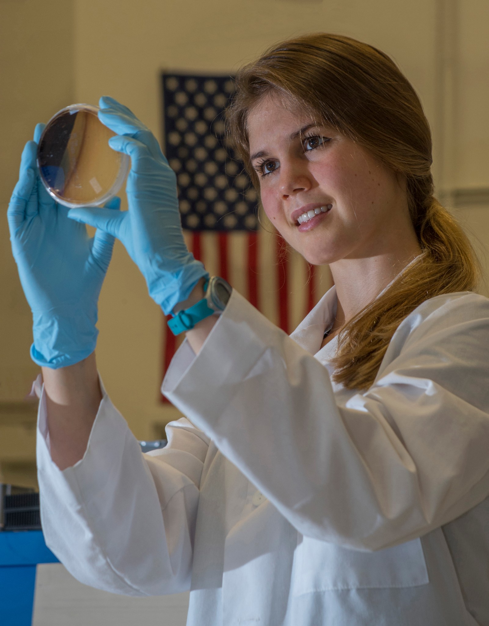Summer intern Morgan Sisk evaluates test results from a microbe growth experiment for NASA’s potential Europa lander.  