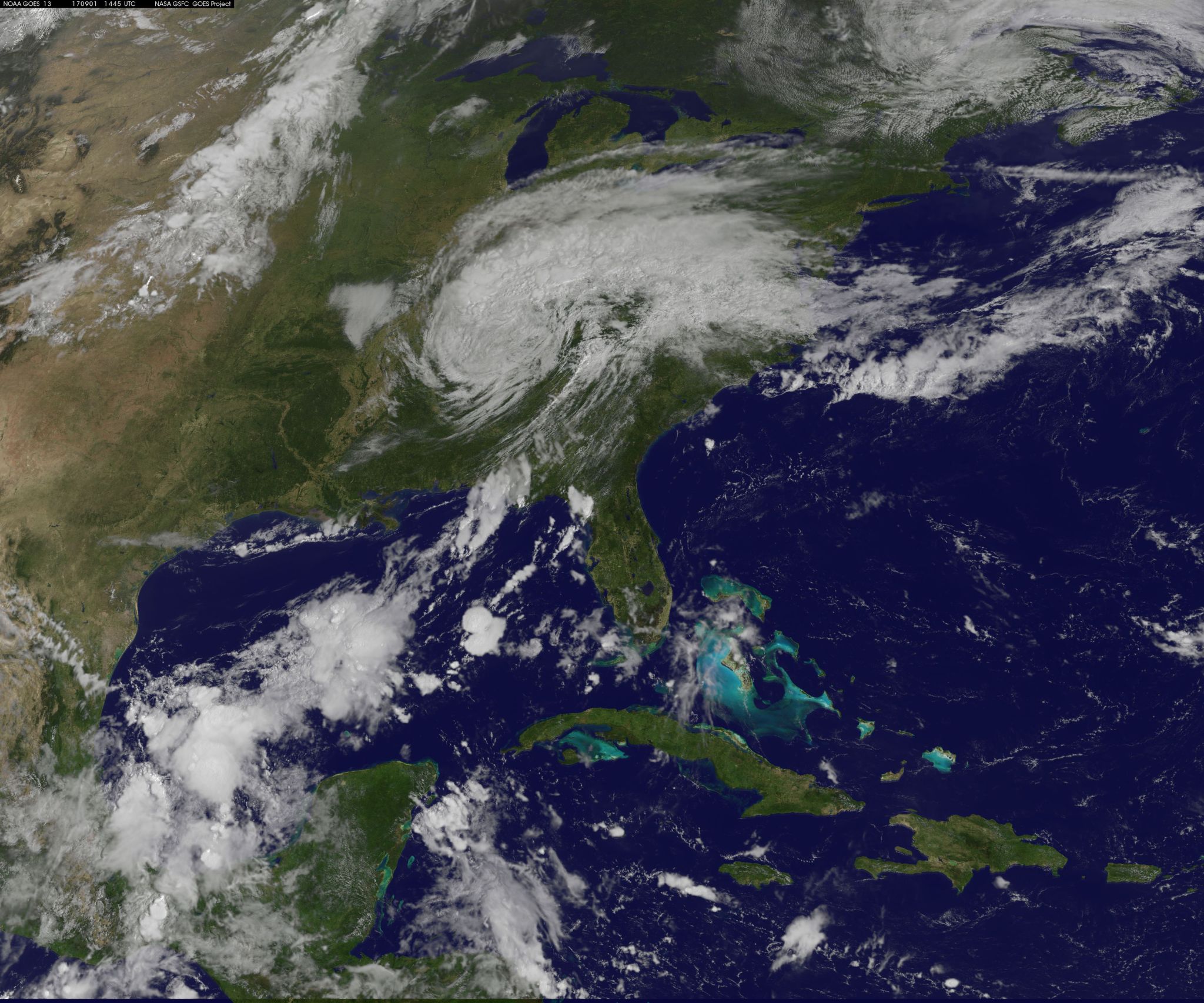 Satellite image of Harvey, a comma shaped cloud mass over the southeast US.