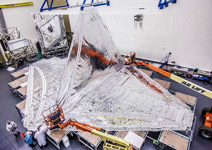 View from above as the final layer of the Webb sunshield is installed. The sunshield is made of thin silver kapton shaped like a diamond.