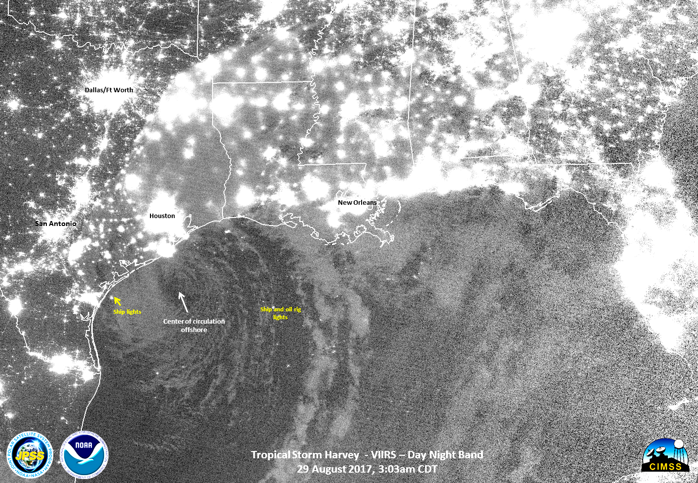 Black and white satellite image of Harvey with electric lights glowing on land.