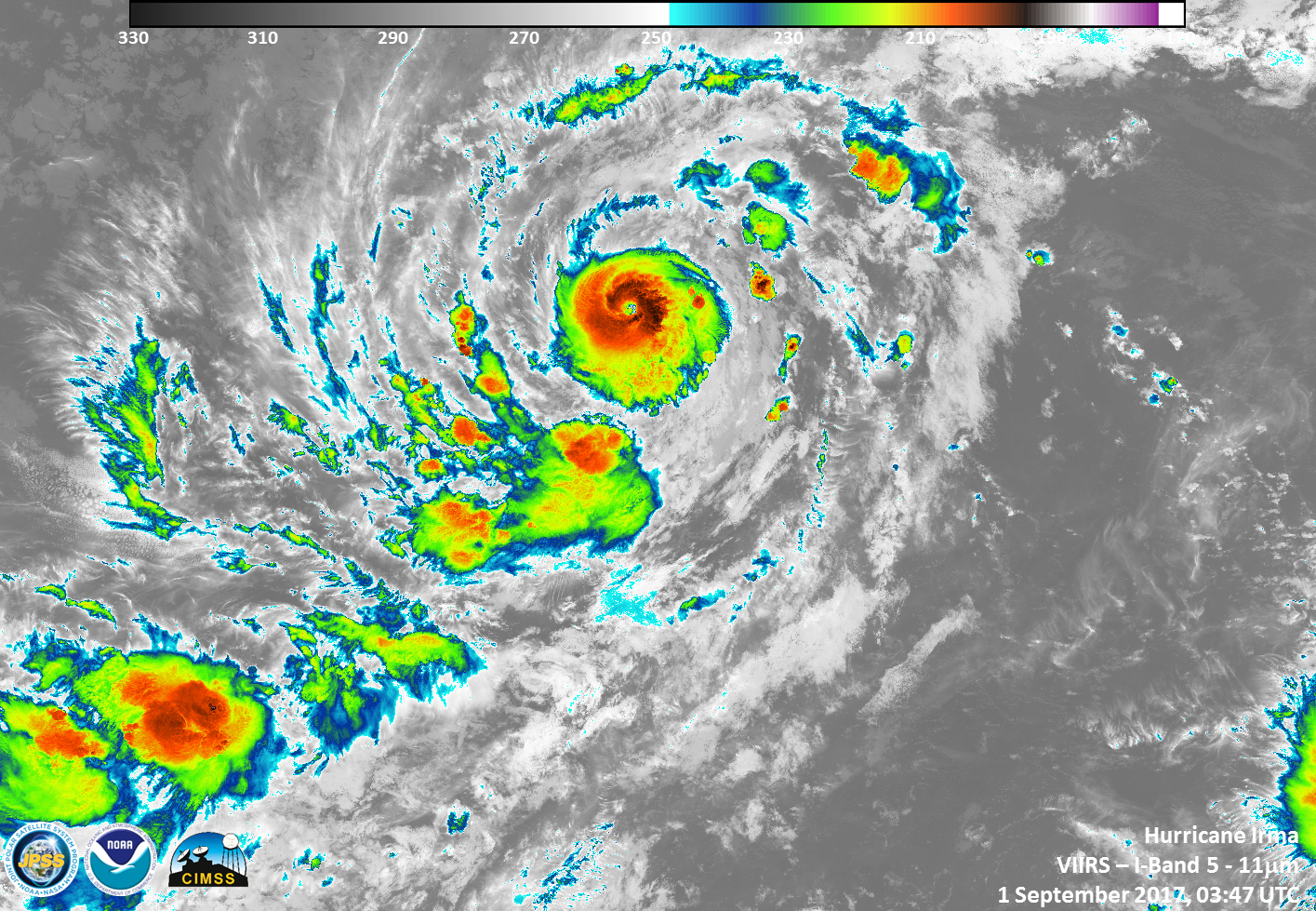 Infrared satellite image of Irma with cloud temperatures in reds, oranges, yellows, and greens.