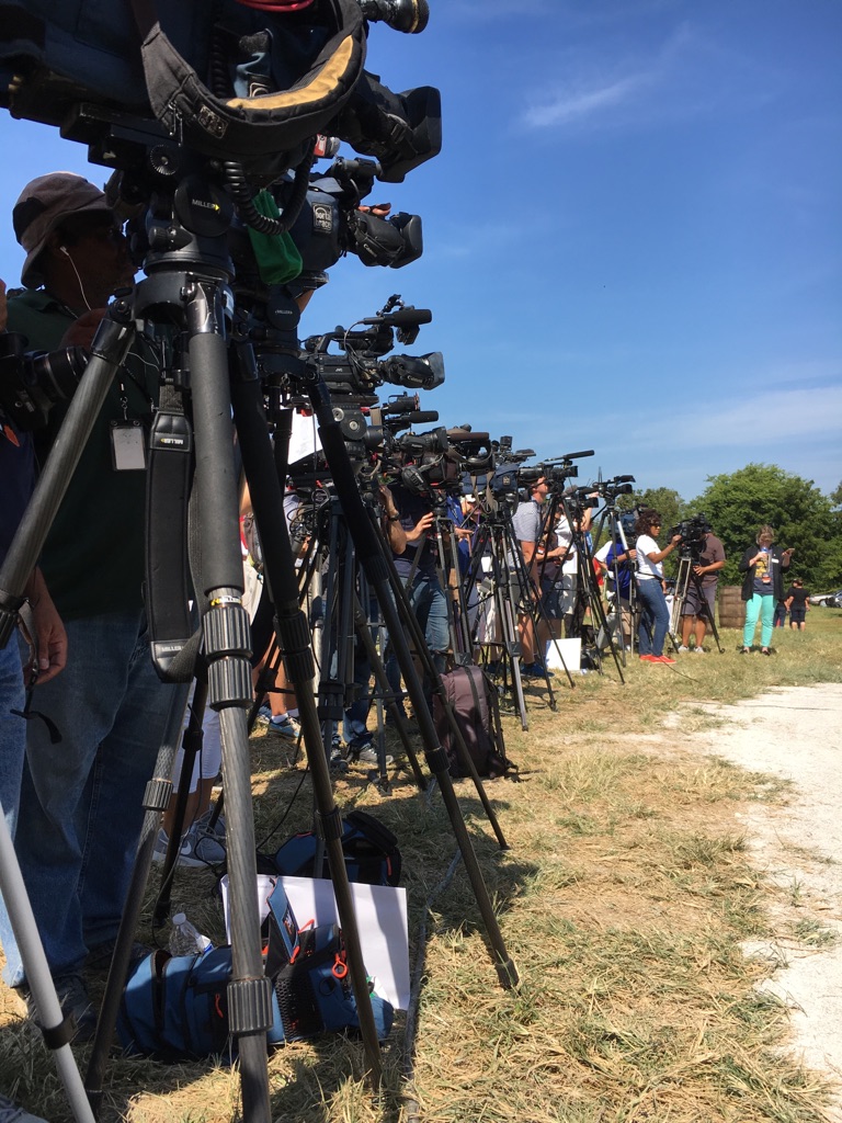 Media members set up television cameras near Hopkinsville, Kentucky.