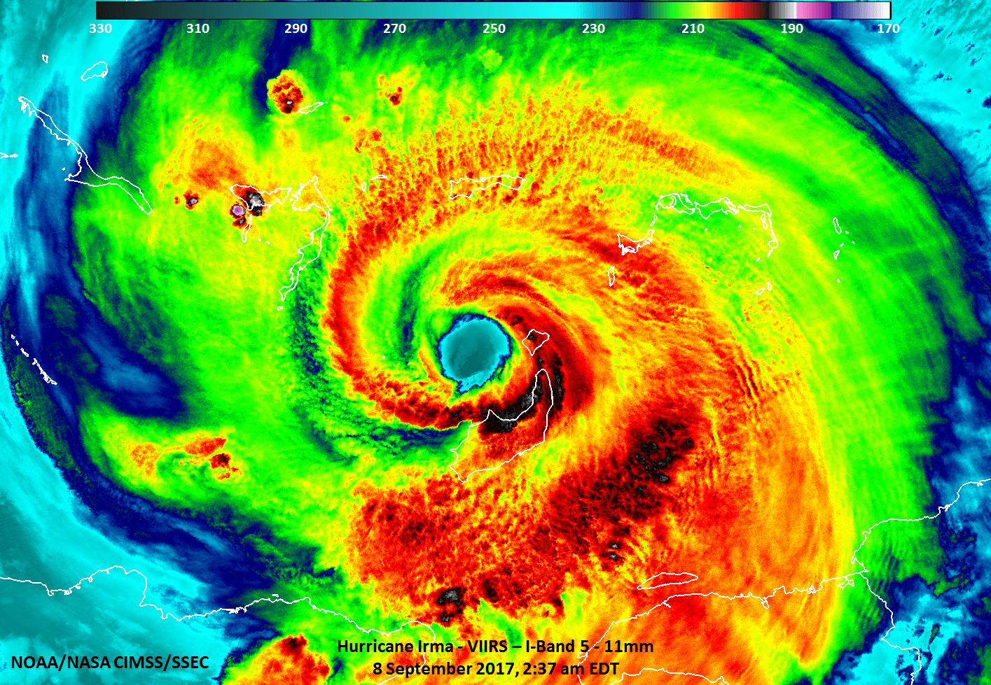 Infrared image of Irma, which looks like a tie dye spiral with reds, yellows, greens, and blues.