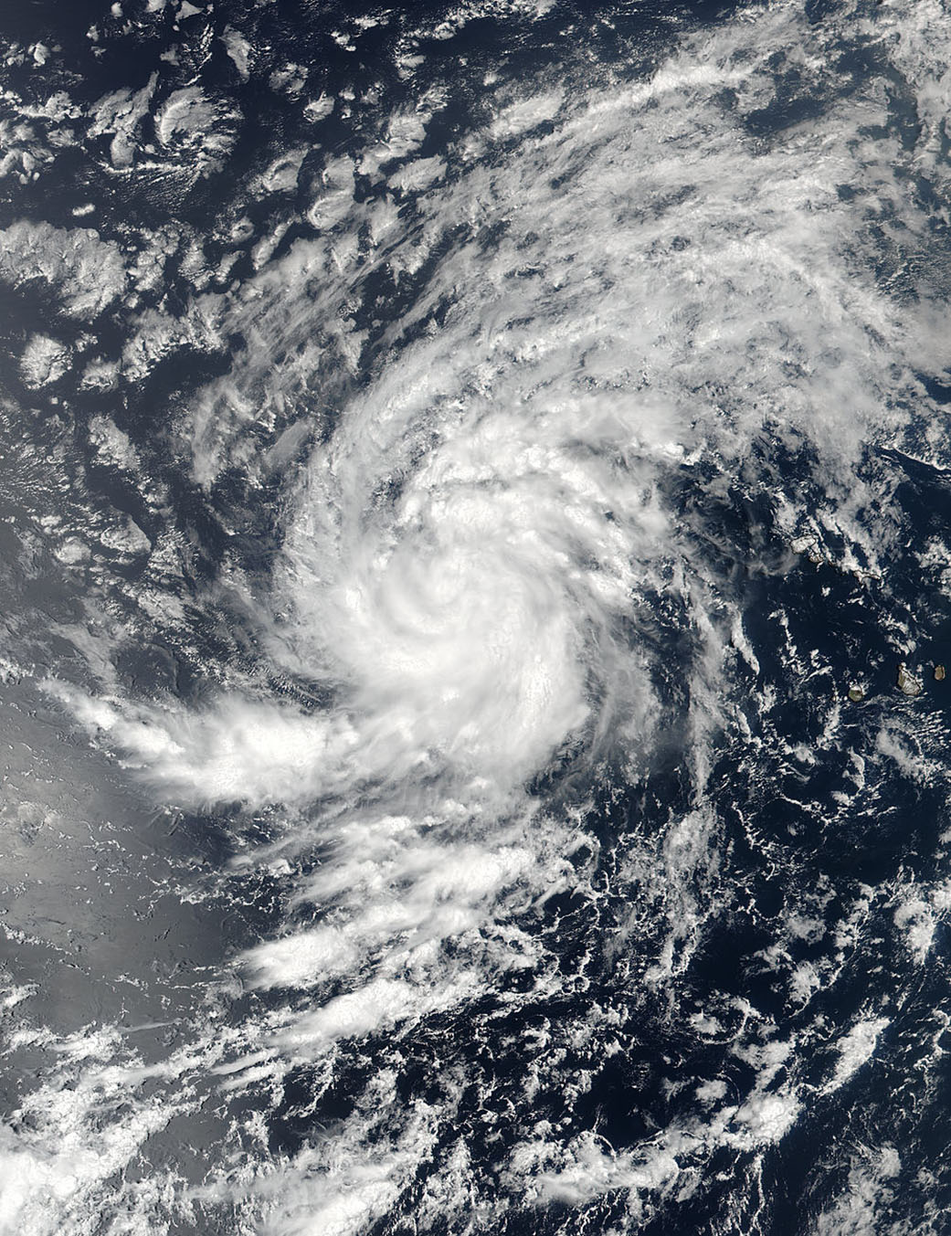 Satellite image of Irma, a scattered cloud mass with some spiraling.