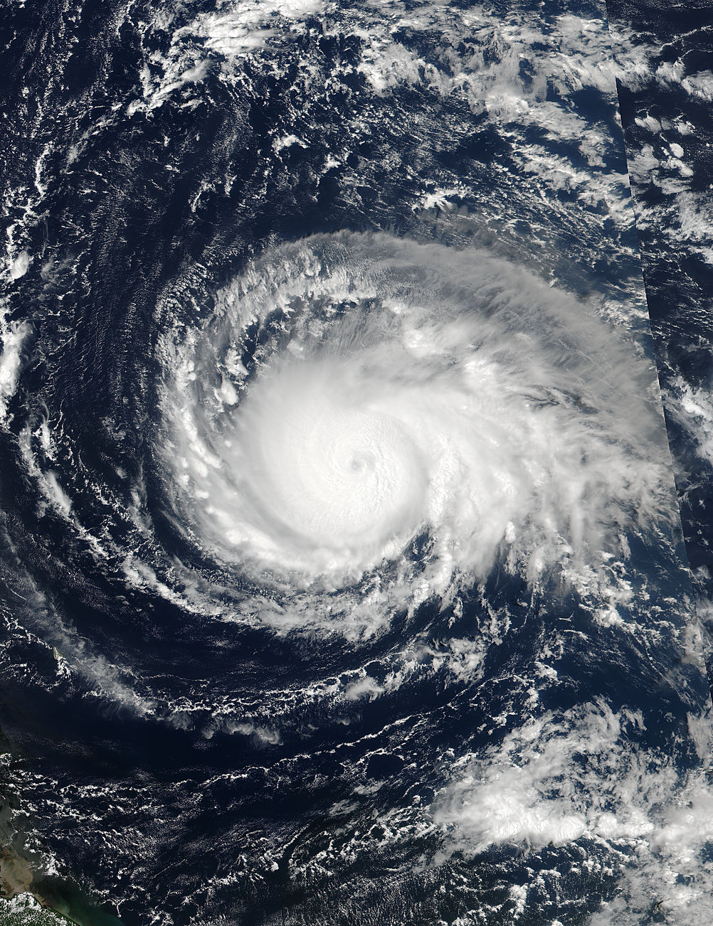 Satellite image of Irma, with a swirling cloud mass over the ocean.