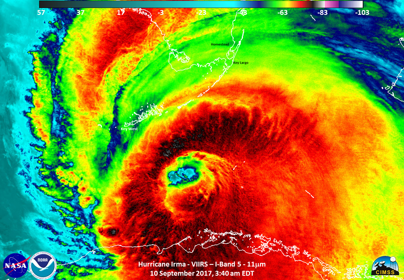 Infrared satellite image of Irma, with clouds in red, yellows, and greens.