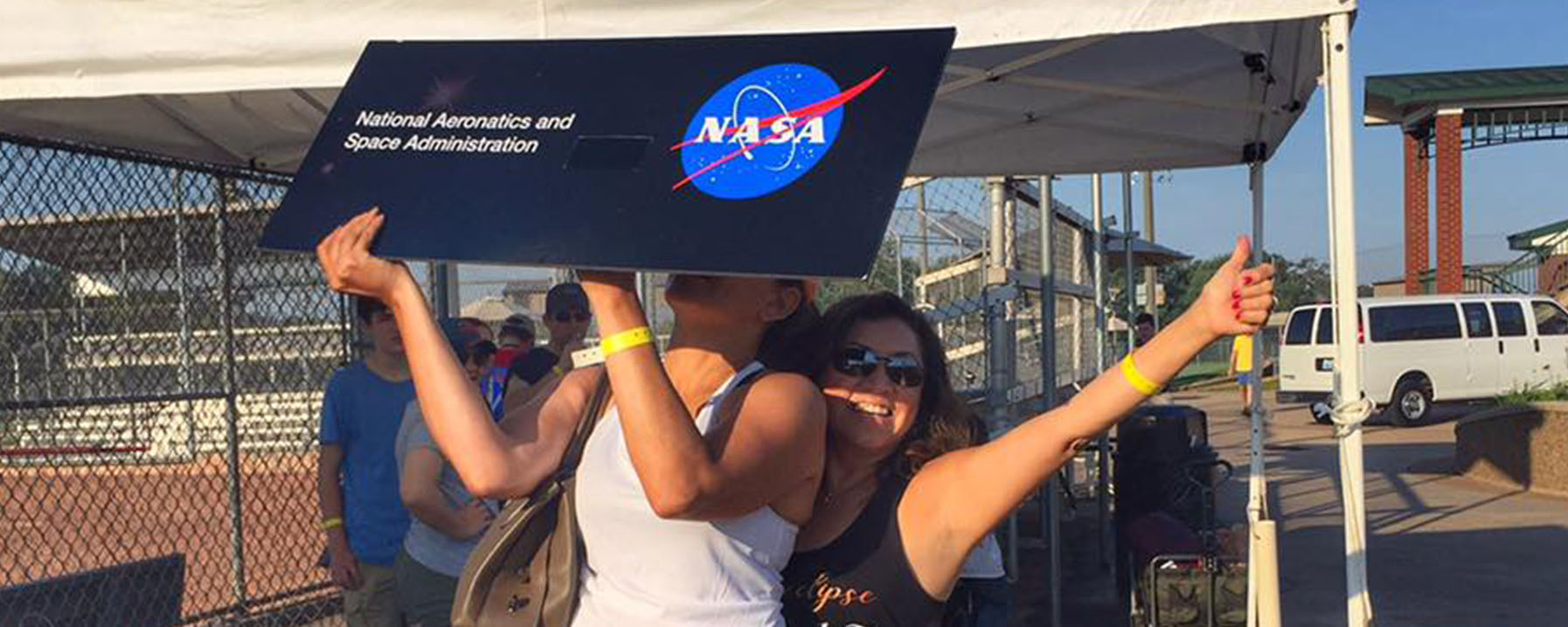 Two Young Ladies Enjoy NASA's Booth for the 2017 Solar Eclipse