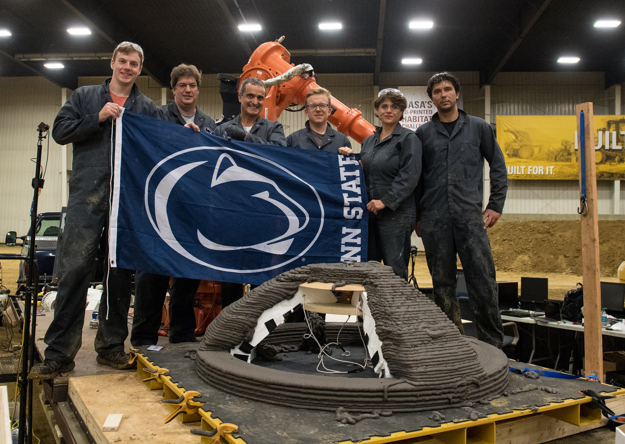 Members of the Penn State Den@Mars team, from University Park, Pa., with their completed 3D-printed dome structure.