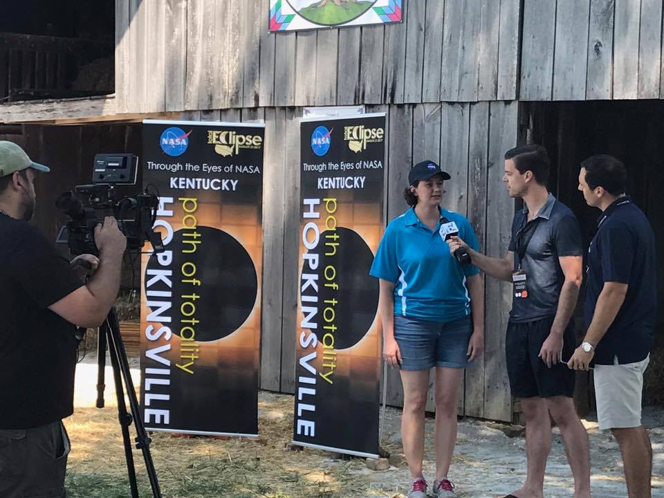 Marshall planetary scientist Renee Weber, center, interviewed Aug. 20 by TV news reporters.
