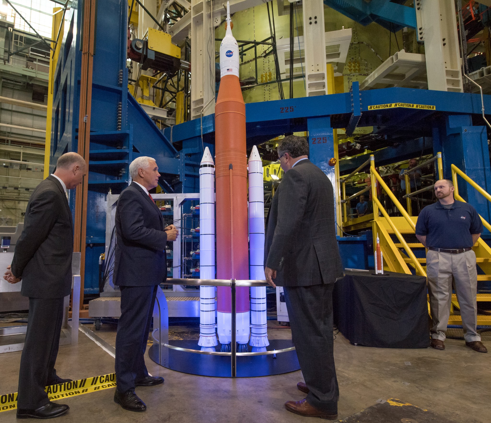 Vice President Mike Pence, left, and Marshall Center Director Todd May, center, talk about the Space Launch System program.