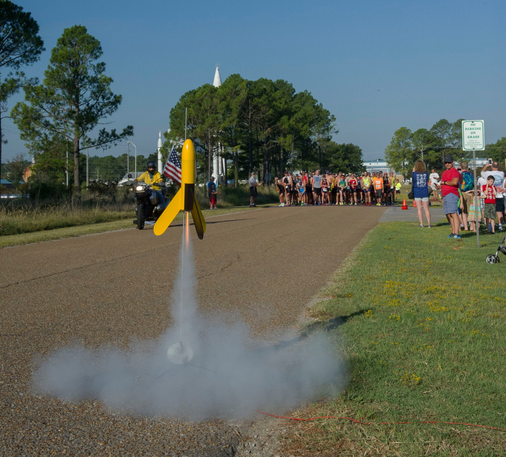 A model rocket launch officially signifies the start of the first running section of the 2016 Racin' the Station duathlon. 